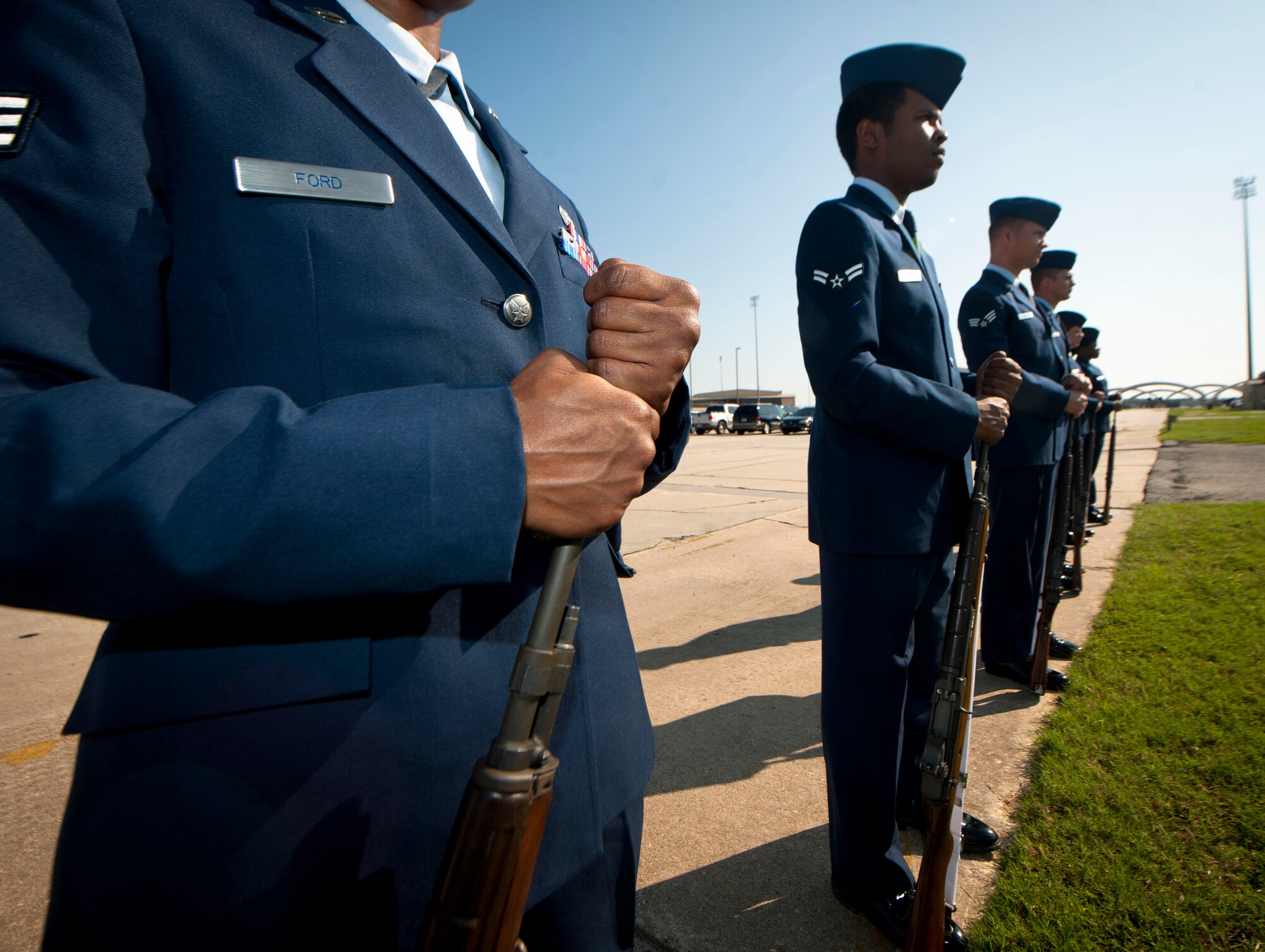 Moody Air Force Base Honor Guard Airmen stand at parade rest before the start of a military honors demonstration at Moody Air Force Base, Ga., Sept. 30, 2011. The event showcases what Team Moody’s honor guard learned from training with U.S. Air Force Honor Guard members for two weeks. (U.S. Air Force photo by Airman 1st Class Joshua Green/Released) 
