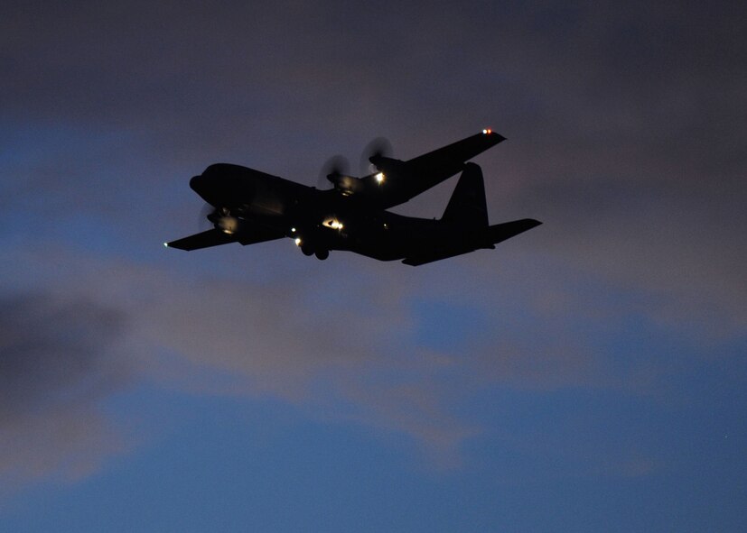 A C-130 Hercules flies at dusk, Sept. 28, 2011, at Dyess Air Force Base, Texas. The C-130H models are currently in the process of being replaced by the new C-130J models. (U.S. Air Force photo by Airman 1st Class Cierra Bullock/Released) 