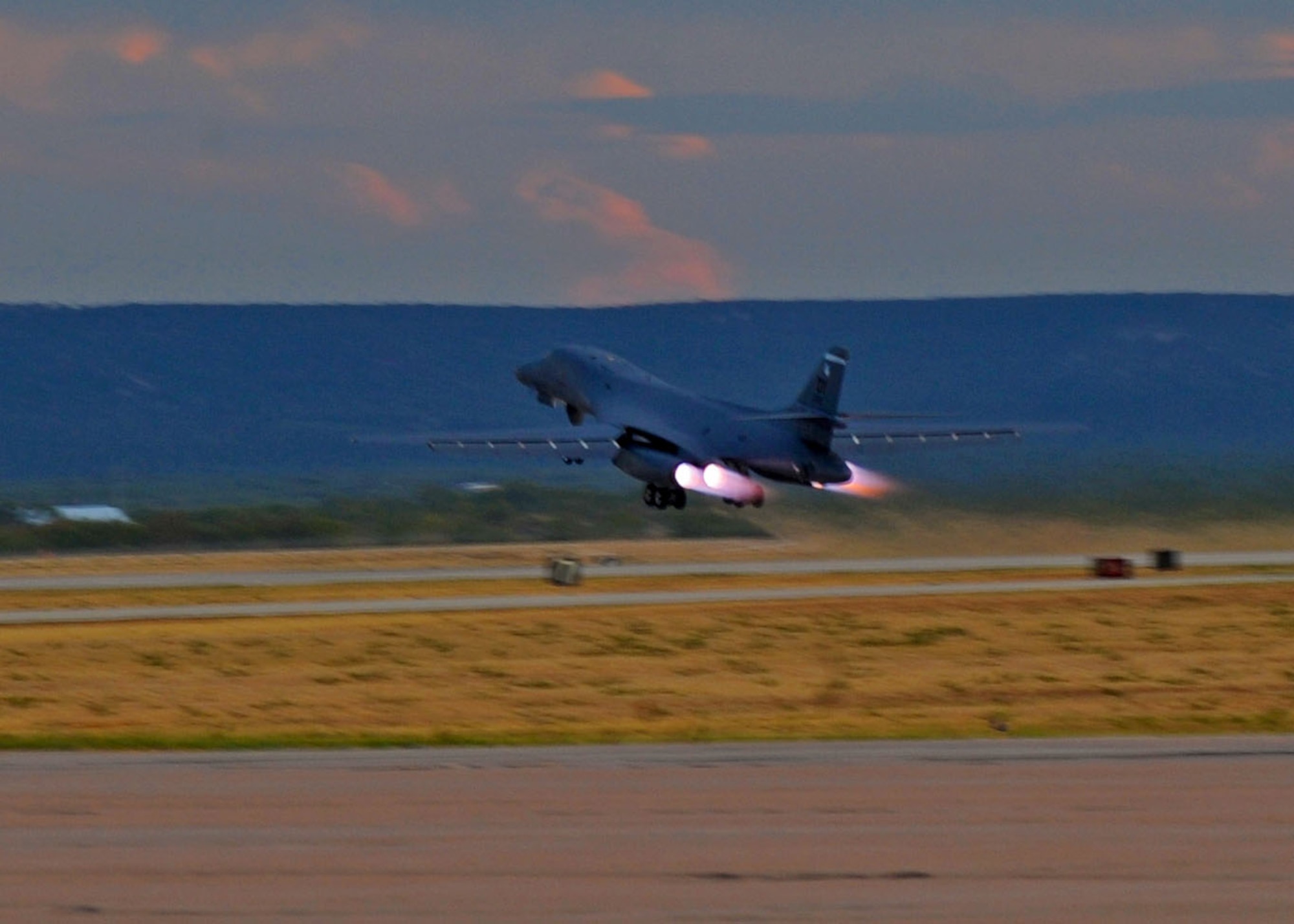 A B-1 Bomber takes off at dusk, Sept. 28, 2011, at Dyess Air Force Base, Texas. The B-1 Bomber carries the largest payload of both guided and unguided weapons in the Air Force Inventory. (U.S. Air Force photo by Airman 1st Class Cierra Bullock/Released)