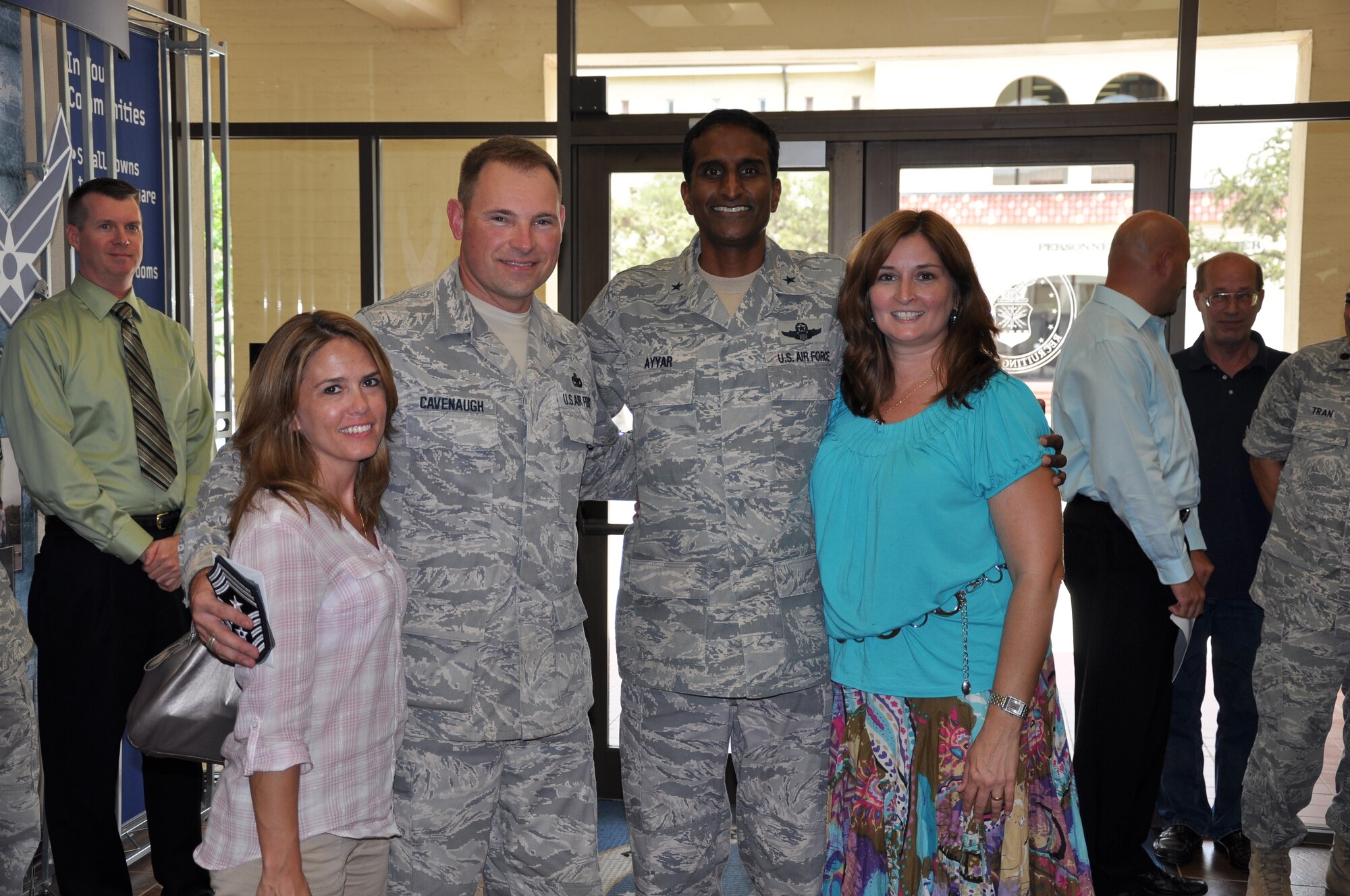 (l-r) Kristi Cavenaugh, Command Chief Master Sgt. William Cavenaugh, Brig. Gen. Balan Ayyar, Kristen Ayyar. Air Force Recruiting Service welcomed Chief Master Sgt. William Cavenaugh as their new command chief in an impromptu ceremony here Aug. 25. (U.S. Air Force photo/Staff Sgt. Hillary Stonemetz)

