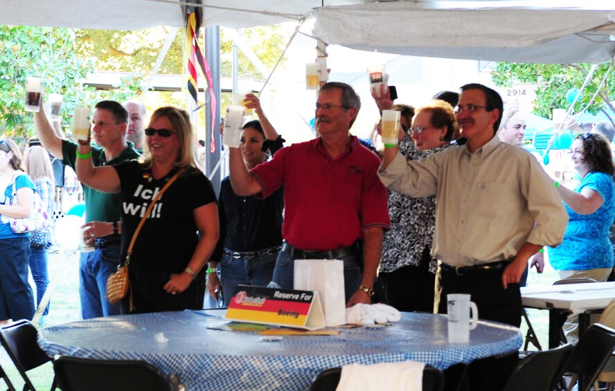 Members of Team Barksdale toast to Oktoberfest on Barksdale Air Force Base, La., Sept. 30. The annual event, attended by more than 1,000 people, had German music and food, and several booths set-up for entertainment. (U.S. Air Force photo/Airman 1st Class Benjamin Gonsier)(RELEASED)
