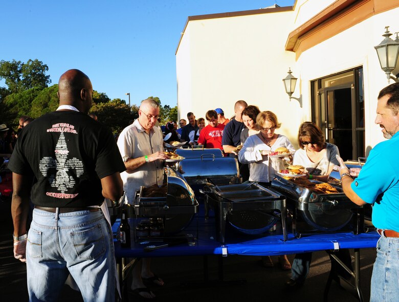 Members of Team Barksdale line-up for food during Oktoberfest on Barksdale Air Force Base, La., Sept. 30. Team Barksdale enjoyed traditional German food and music to help celebrate the annual event. (U.S. Air Force photo/Airman 1st Class Benjamin Gonsier)(RELEASED)