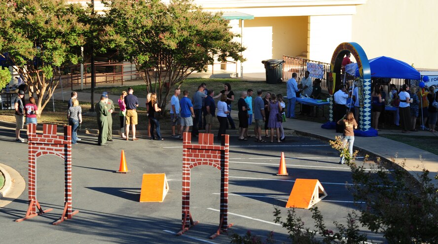 Members of Team Barksdale line-up to enter the annual Oktoberfest celebration held on Barksdale Air Force Base, La., Sept. 30. More than 50 volunteers helped set-up and run the event, hosted by the Barksdale Company Grade Officer's Council. (U.S. Air Force photo/Airman 1st Class Benjamin Gonsier)(RELEASED)
