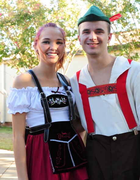 Team Barksdale members show off traditional Oktoberfest attire on Barksdale Air Force Base, La., Sept. 30. Ladies often wear dirndl dresses while men traditionally wear lederhosen to the annual German event. (U.S. Air Force photo/Airman 1st Class Benjamin Gonsier)(RELEASED)