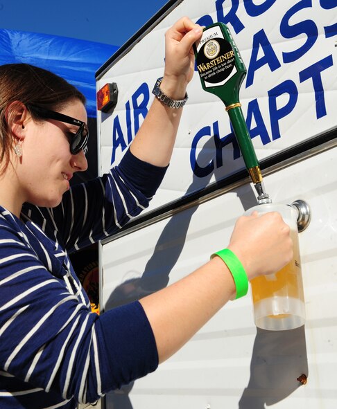1st Lt. Heidi Kaufman, 2nd Operations Group, fills a mug during Oktoberfest on Barksdale Air Force Base, La., Sept. 30. More than 50 volunteers from Team Barksdale helped set-up and run the event. (U.S. Air Force photo/Airman 1st Class Benjamin Gonsier)(RELEASED)