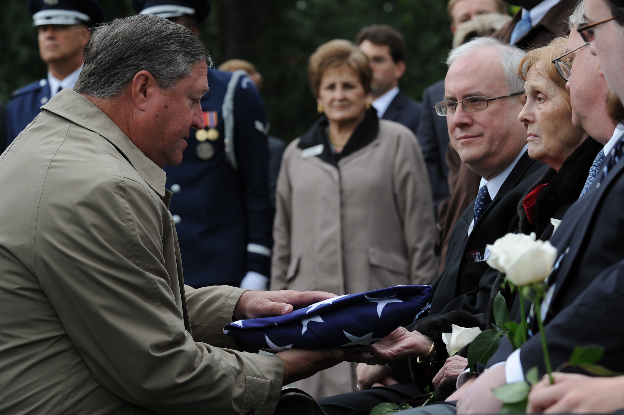 Secretary of the Air Force Michael Donley presents the American flag to Penni Alison during the funeral for retired Maj. Gen. John Alison at Arlington National Cemetery, Va., Oct. 3, 2011. Alison is often referred to as the father of Air Force special operations forces and was survived by his wife and two sons, John and David. (U.S. Air Force photo/Staff Sgt. Christopher Ruano)