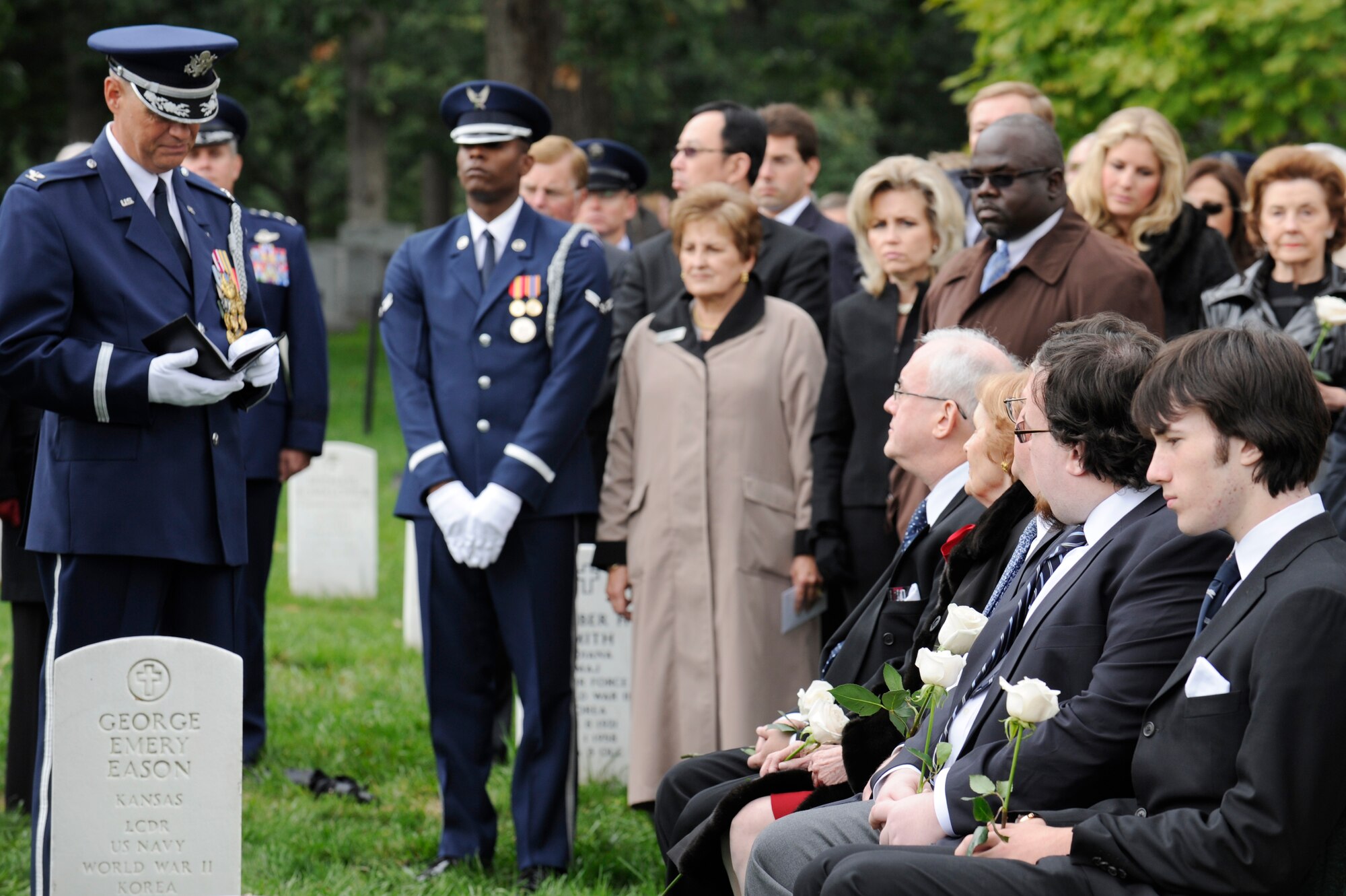 Col. (Chaplain) Charles R. Cornelisse provides comfort to wife Penni Alison, and sons John and David Alison, Oct. 3, 2011, during the funeral of retired Maj. Gen. John Alison. Alison became a world War II fighter ace during missions in the China-Burma-India theater.  He was awarded the Distinguished Service Cross and the Silver Star for his combat exploits. (U.S. Air Force photo/Tech. Sgt. Raymond Mills)