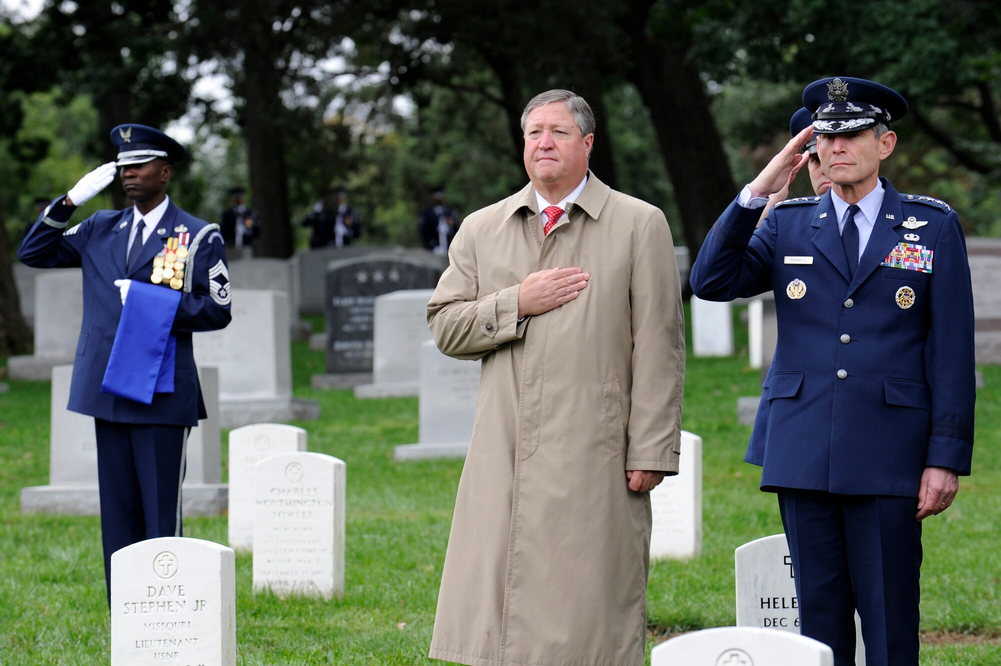 Secretary of the Air Force Michael Donley and Air Force Chief of Staff Gen. Norton Schwartz pay their respects Oct. 3, 2011, at Arlington National Cemetery, Va., during the full-honors funeral of retired Maj. Gen. John Alison. Alison was a war hero and founding father of the Air Force’s special operations forces, having served with the Flying Tigers’ 75th Fighter Squadron and the 1st Air Commando Group during World War II.  (U.S. Air Force photo/Tech. Sgt. Raymond Mills)