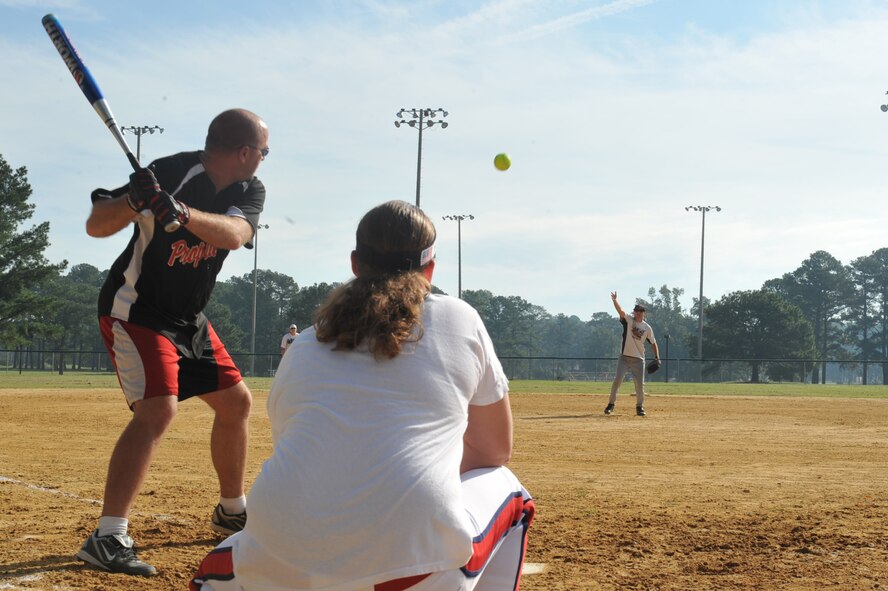 Tech. Sgt Timothy Livengood pitches a softball to Master Sgt. Timothy Keller during Wing Sports Day at Seymour Johnson Air Force Base, N.C., Sept. 30, 2011. Players had one chance to hit the ball pitched to them. Livengood is a 4th Equipment Maintenance Squadron aerospace ground equipment craftsman and a native of Morgantown, W.Va. Keller is a 4th Component Maintenance Squadron jet engine maintenance superintendant and a native of Lawrence, Mich. (U.S. Air Force photo by Senior Airman Whitney Stanfield)