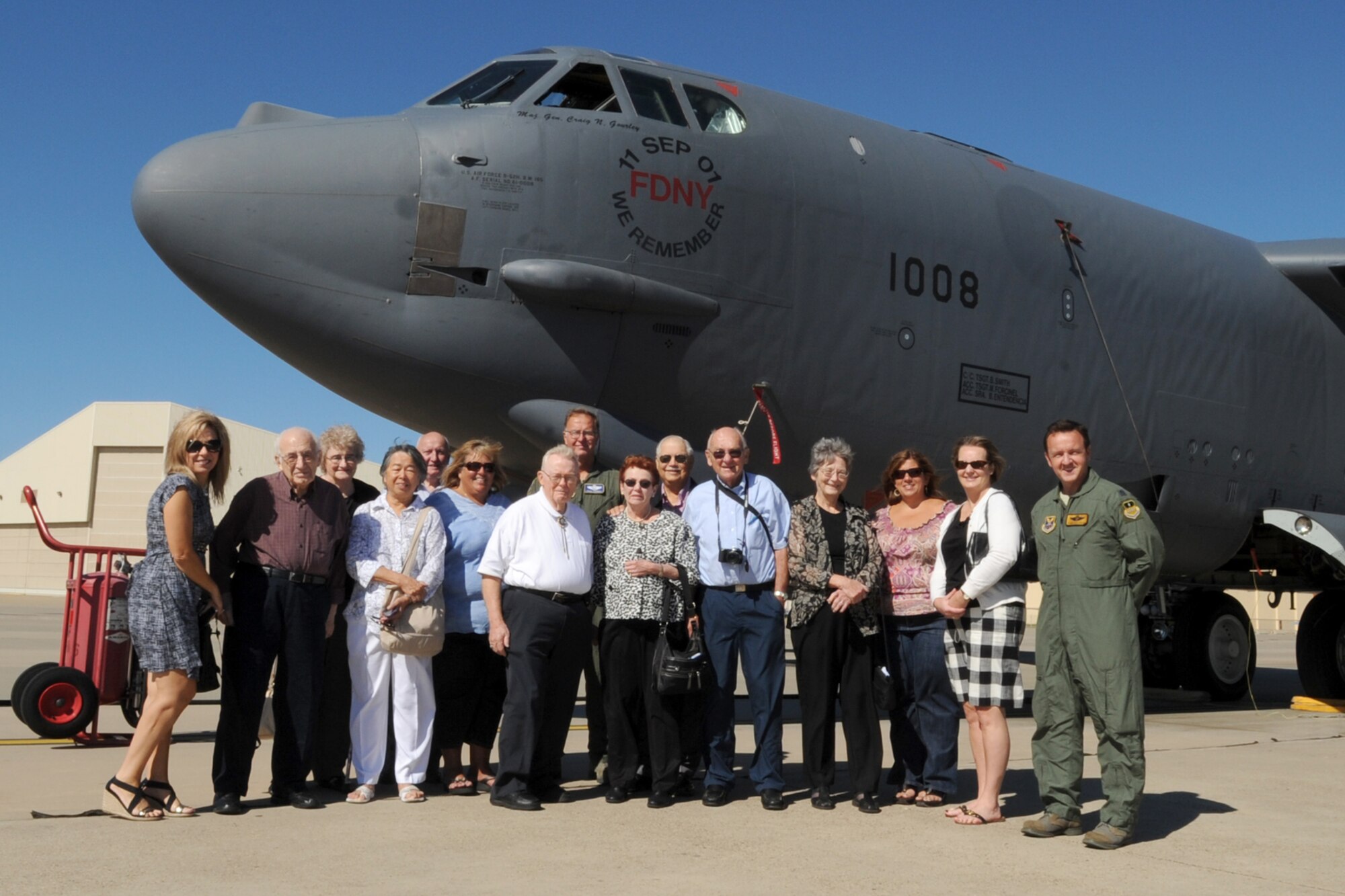 Retired members and family of the Alaskan Singing Sergeants gather for a group photo in front of a 93rd Bomb Squadron B-52 Stratofortress during their reunion at Barksdale Air Force Base, La., Oct. 2, 2011. The Alaskan Singing Sergeants were formed at Elmendorf Air Force Base, Alaska, in 1951, and toured Japan and Korea, singing for the troops stationed there. (U.S. Air Force photo by Master Sgt. Greg Steele/Released)