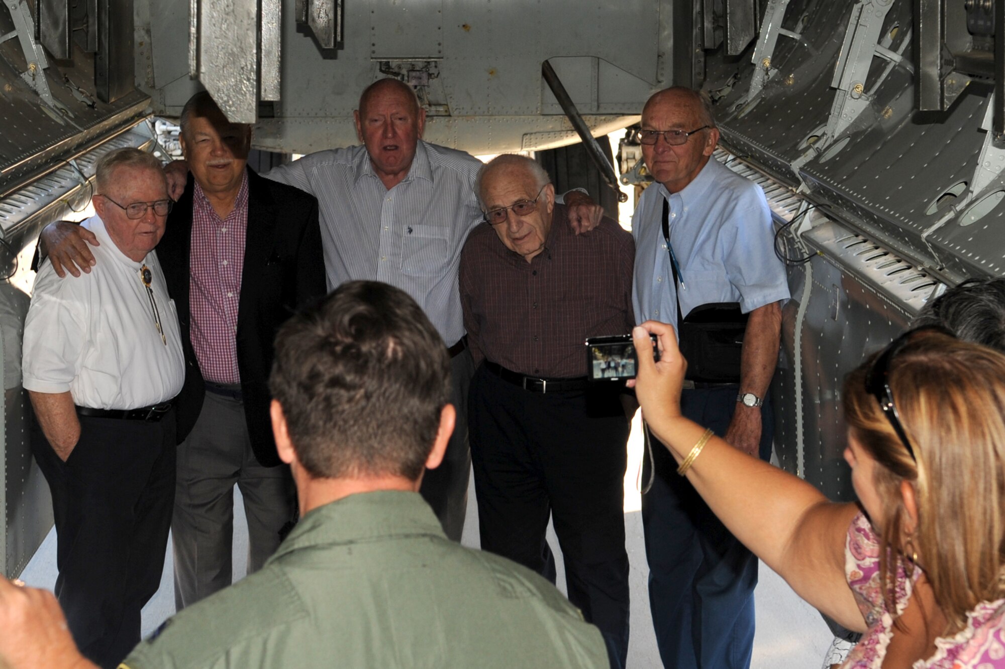 The Alaskan Singing Sergeants take a break from their tour of a B-52 Stratofortress, to sing the Air Force Song, Barksdale Air Force Base, La., Oct. 2, 2011. The group, which was formed in Elmendorf Air Force Base, Alaska, in early the 1950’s, held their reunion at Barksdale and was treated with a tour of the base and aircraft. (U.S. Air Force photo by Master Sgt. Greg Steele/Released)
