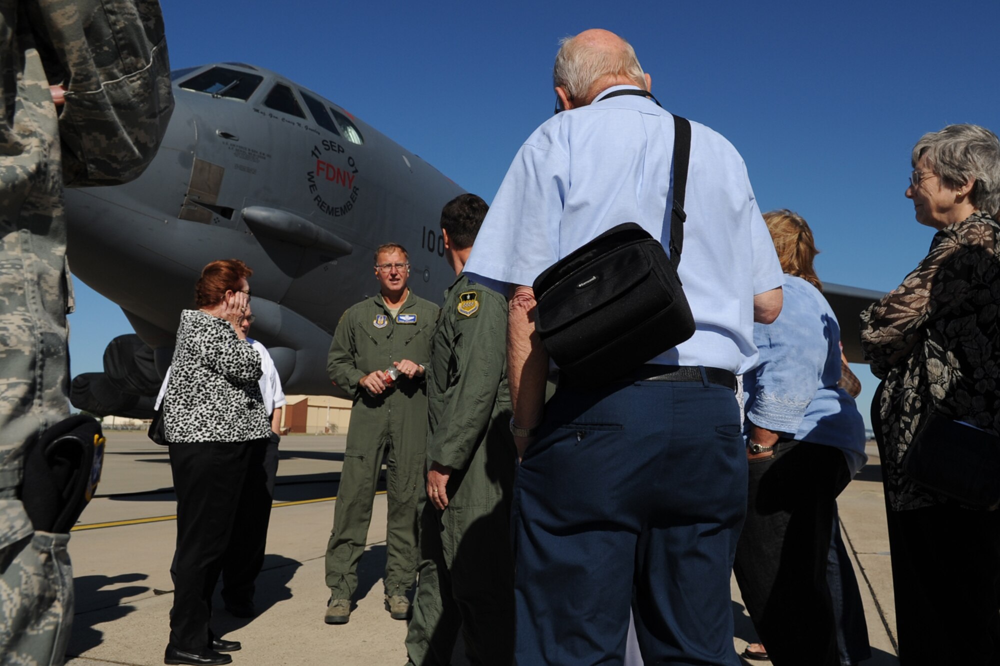 U.S. Air Force Lt. Col. Frank Stepongzi, Air Force Reserve Command flight standards division deputy chief, talks to members of the Alaskan Singing Sergeants about the B-52 Stratofortress and its mission during their visit to Barksdale Air Force Base, La., Oct. 2, 2011. The now retired Alaskan Singing Sergeants were stationed at Elmendorf Air Force Base, Alaska, in the early 1950’s, and frequently toured Japan and Korea, singing for the troops stationed there. (U.S. Air Force photo by Master Sgt. Greg Steele/Released)