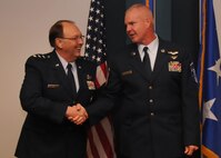 Lt. Gen. Charles Stenner, AFRC commander, shakes Reservist Steve Stanton's hand after promoting to him master sergeant. Stenner for at the 916th Air Refueling Wing on Oct. 3, 2011 as part of his East Coast Tour. (USAF photo by SrA Meredith Thomas, 916ARW/PA)