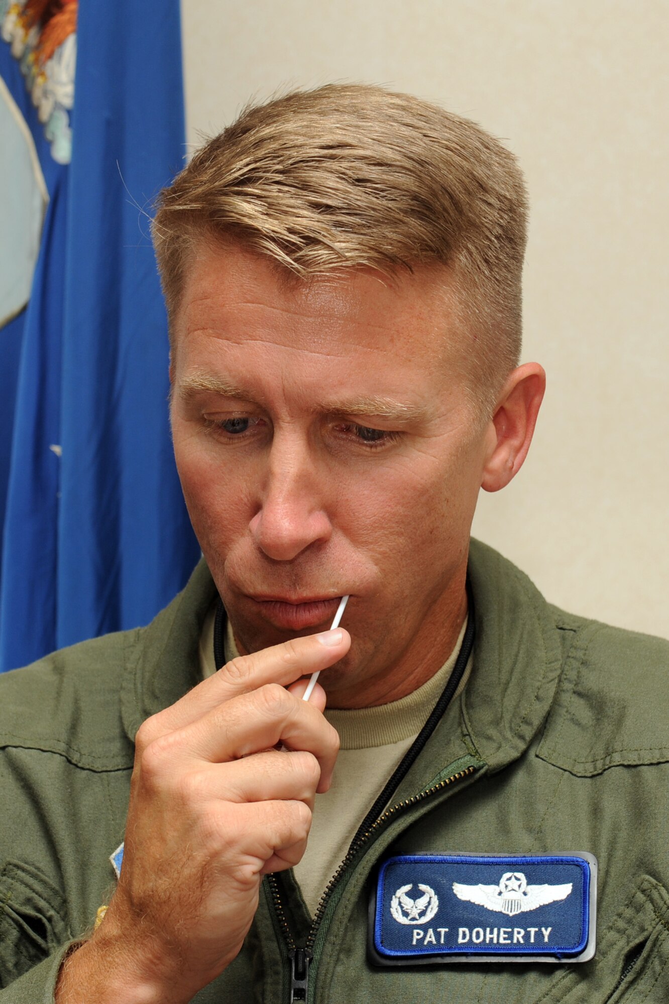 Colonel Patrick Doherty swabs his upper left cheek at Seymour Johnson Air Force Base, N.C., during a bone marrow drive, Sept. 27, 2011. All Department of Defense card holders including active duty, reserve members, dependents, civilians and contractors ages 18 to 61 are eligible to participate in a bone marrow drive running Sept. 26-30. Doherty is the 4 FW commander and a native of Lincoln, Neb. (U.S. Air Force photo by Senior Airman Whitney Stanfield)