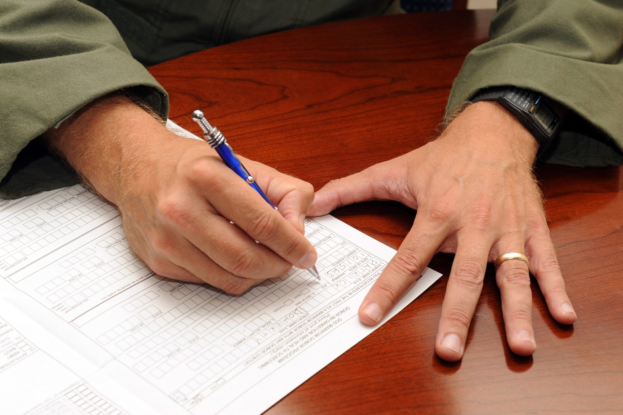 Colonel Patrick Doherty fills out a bone marrow consent form at Seymour Johnson Air Force Base, N.C., during a bone marrow drive, Sept. 27, 2011. Individuals registered, signed consent forms and were provided a Buccal swab collection kit to swab the inside of their mouth to determine their human leukocyte antigen type. Doherty is the 4 FW commander and a native of Lincoln, Neb. (U.S. Air Force photo by Senior Airman Whitney Stanfield) 