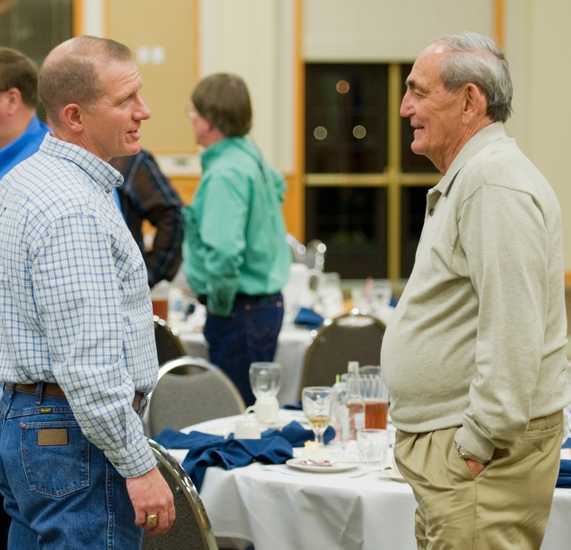 Col. Robert Stanley, 341st Missile Wing vice commander, chats with long time military supporter Warren Wentz following the annual Salute to the Community Dinner Sept. 22. (U.S. Air Force photo/Beau Wade)