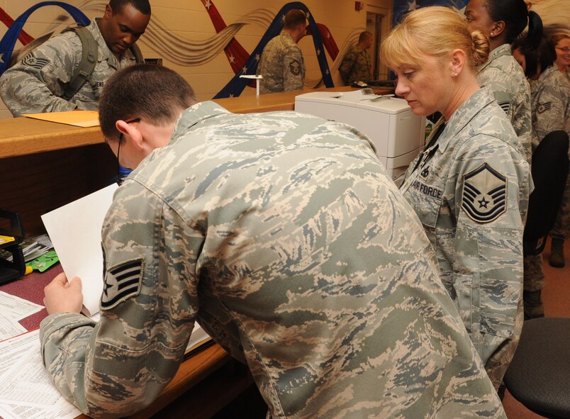 Master Sgt. Bambi McPherson evaluates paperwork during a deployment processing line on Seymour Johnson Air Force Base, N.C., Sept. 29, 2011. McPherson, a 4th Fighter Wing exercise evaluation coordinator, checks all inspectable unit compliance inspection items, safety programs and tools to ensure Airmen are kept up to date. McPherson is a native of Colorado Springs, Colo. (U.S. Air Force photo by Senior Airman Whitney Stanfield)