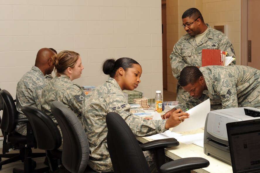The Airman and Family Readiness Center, base chapel, finance office, Southern Eagle Dining Facility, and legal office offer last-minute services to deployers during a deployment processing line on Seymour Johnson Air Force Base, N.C., Sept. 29, 2011. Agencies from around base help make the transition process easier for leaving and returning deployers. (U.S. Air Force photo by Senior Airman Whitney Stanfield)