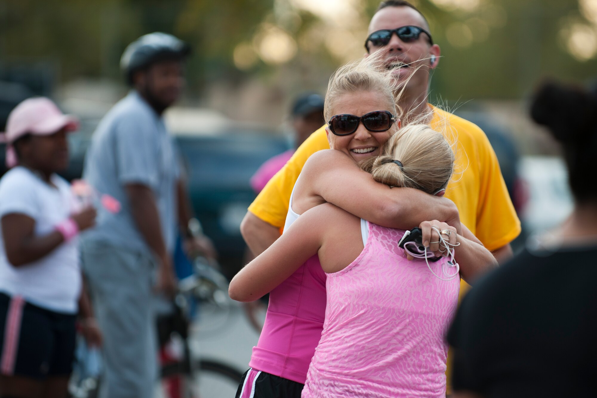 Participants celebrate after finishing the 5K portion of the National Breast Cancer Awareness Month event Oct. 1, 2011, at Arkadas Park at Incirlik Air Base, Turkey. The event was sponsored by the Health and Wellness Center, fitness center and women's health clinic to raise breast cancer awareness and money for a donation to the Susan G. Komen For the Cure Foundation. (U.S. Air Force photo by Tech. Sgt. Michael B. Keller/Released)