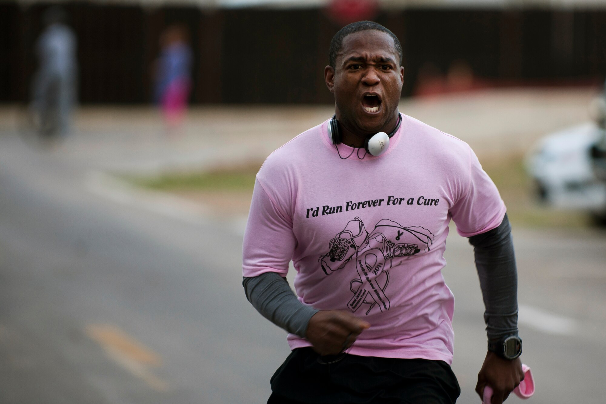 Tech. Sgt. Curtis Hill, 39th Air Base Wing executive assistant to the command chief, finishes the 5K portion of the National Breast Cancer Awareness Month event Oct. 1, 2011, at Arkadas Park at Incirlik Air Base, Turkey. The event was sponsored by the Health and Wellness Center, fitness center and women's health clinic to raise breast cancer awareness and money for a donation to the Susan G. Komen For the Cure Foundation. (U.S. Air Force photo by Tech. Sgt. Michael B. Keller/Released)