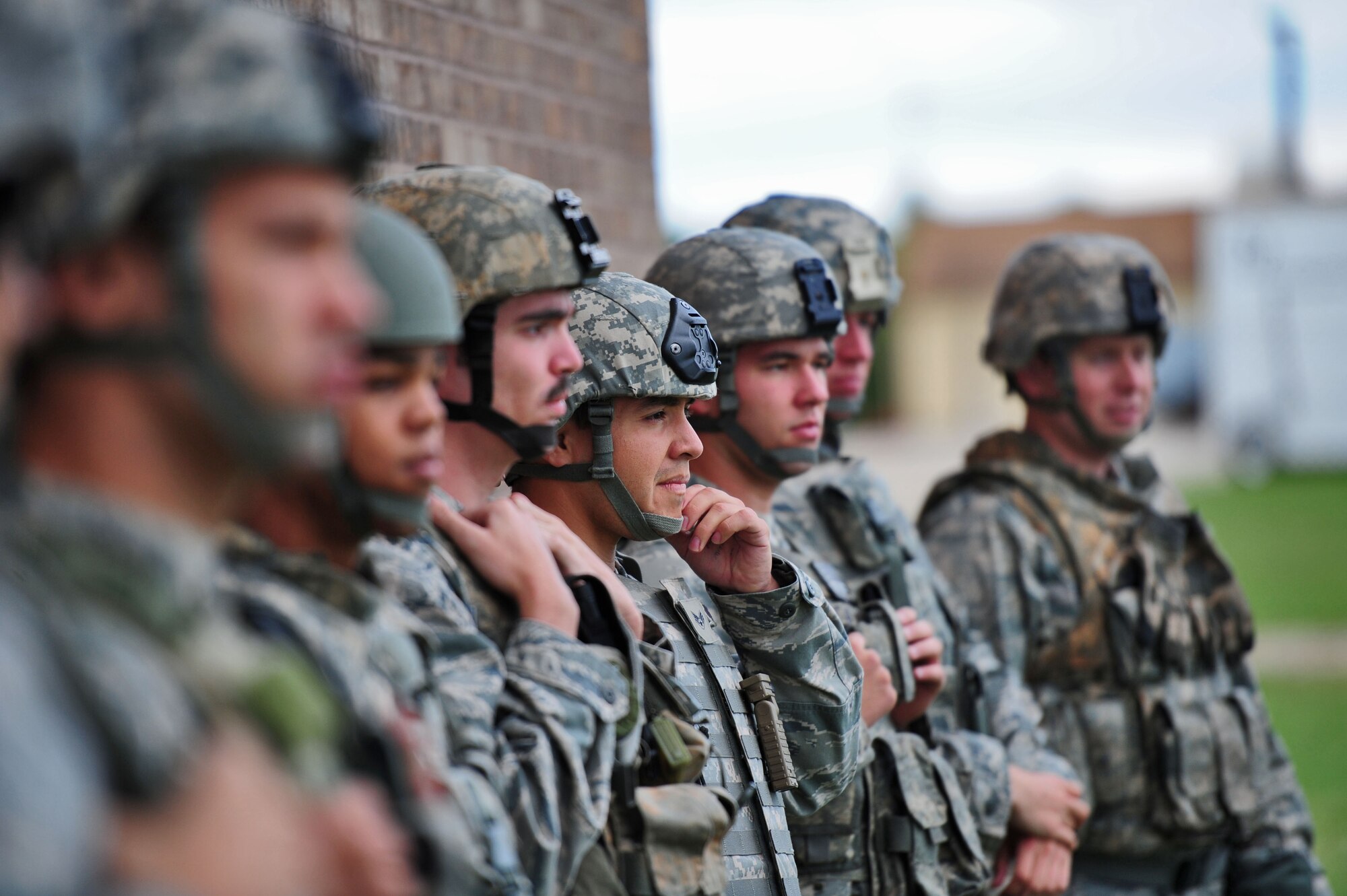 Airmen from the 509th Security Forces Squadron are briefed prior to participating in the land navigation portion of the Air Force Global Strike Command Challenge try-outs here Sept. 21. The land navigation portion was one of six components including a mental challenge, physical training, weapons qualification and a written test. Each Airman wore a Kevlar helmet and vest during all events. Of those competing, seven will be placed on the challenge team to represent Whiteman Air Force Base at the Air Force Global Strike Challenge in November at Barksdale Air Force Base, La. (U.S. Air Force photo/Senior Airman Nick Wilson)