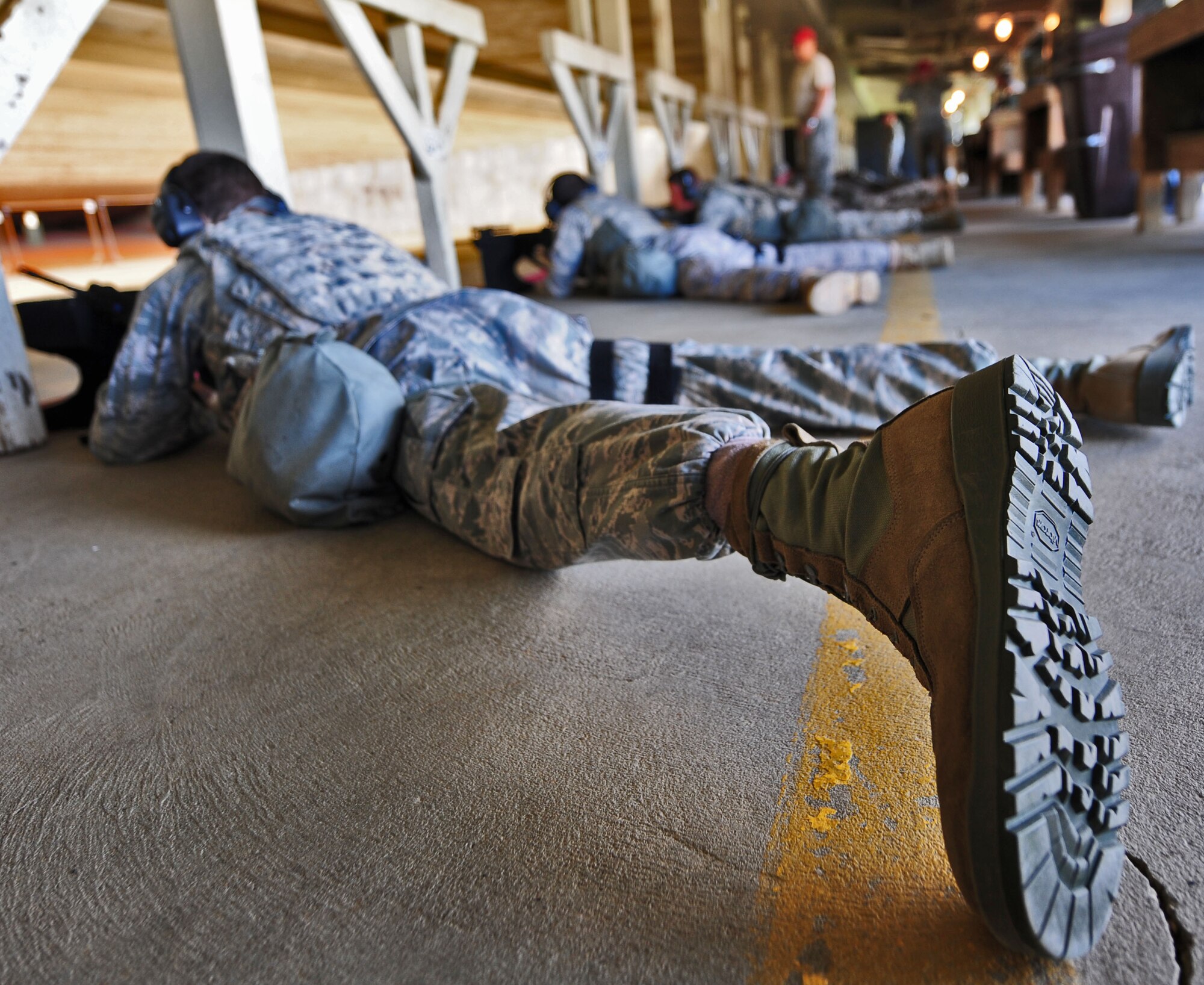 Airmen from the 509th Security Forces Squadron fire their M4s during the combat arms portion of the Air Force Global Strike Command Challenge try-outs here Sept. 21. Seven selectees will be chosen to represent Whiteman Air Force Base at the second-annual Global Strike Challenge at Barksdale Air Force Base, La. Nov. 5-7. The team will compete against participating security forces squadrons from across the command. (U.S. Air Force photo/Senior Airman Nick Wilson)
