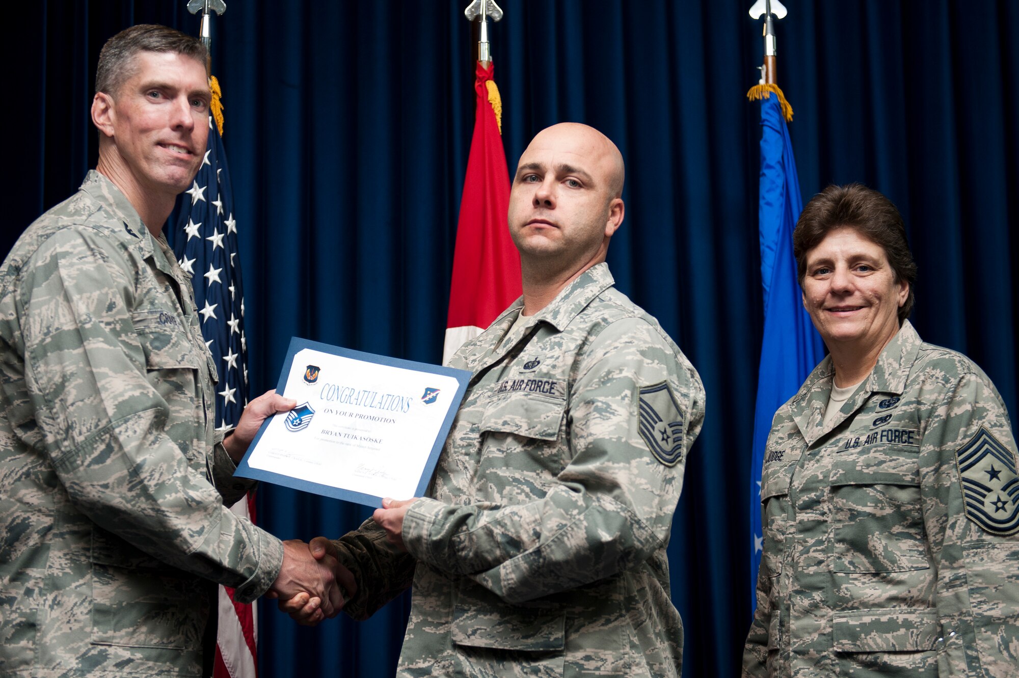 Bryan Tuika-Soske, 39th Force Support Squadron, is promoted to the rank of master sergeant Sept. 30, 2011, at the Club Complex ballroom at Incirlik Air Base, Turkey. (U.S. Air Force photo by Tech. Sgt. Michael B. Keller/Released)