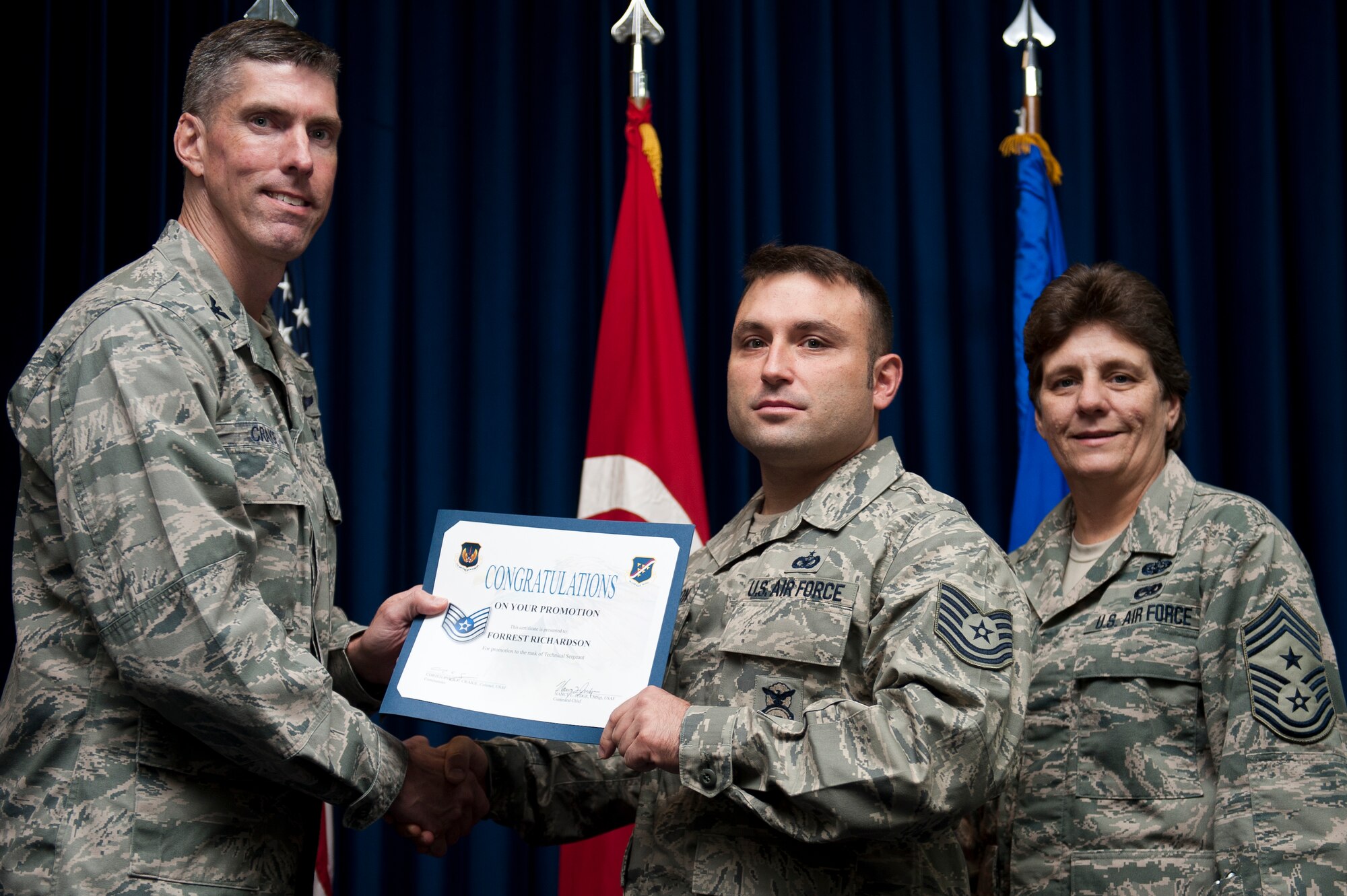 Forrest Richardson, 39th Security Forces Squadron, is promoted to the rank of technical sergeant Sept. 30, 2011, at the Club Complex ballroom at Incirlik Air Base, Turkey. (U.S. Air Force photo by Tech. Sgt. Michael B. Keller/Released)