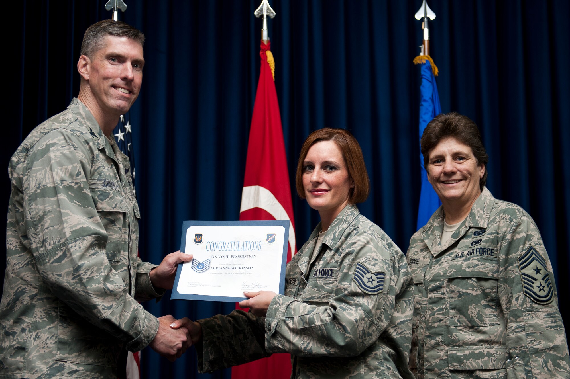 Adrianne Wilkinson, 39th Mission Support Group, is promoted to the rank of technical sergeant Sept. 30, 2011, at the Club Complex ballroom at Incirlik Air Base, Turkey. (U.S. Air Force photo by Tech. Sgt. Michael B. Keller/Released)