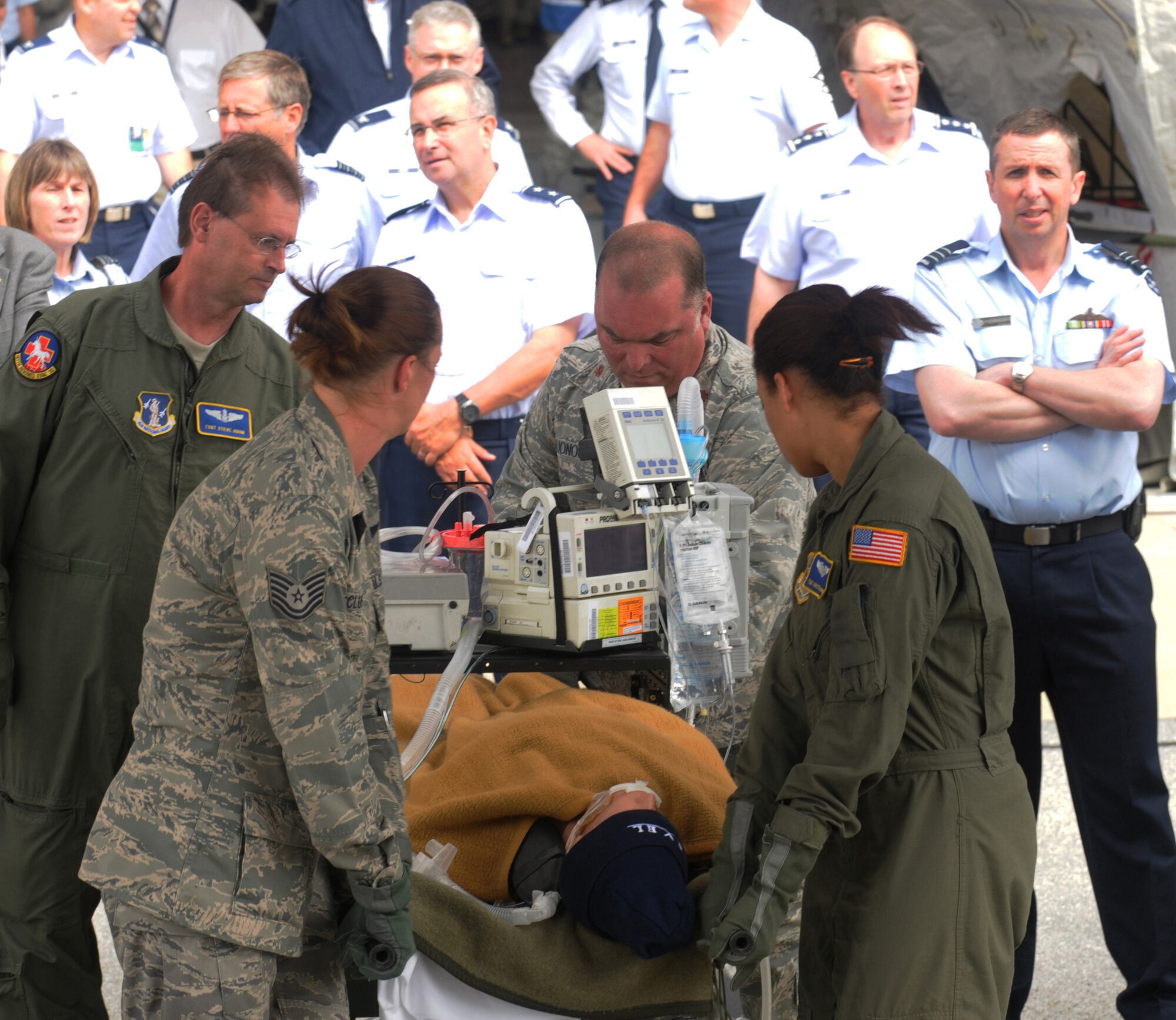 The Critical Care Air Transport Team, a combined Air National Guard team carries a patient on the aircraft on Sept. 29, 2011 Chemical Response Force Package demonstration during the International Air Reserve Symposium at Joint Base Andrews, MD.  CERFP demonstrations feature domestic operations capabilities for IARS, a voluntary gathering of senior Air Force Reserve representatives from global Air Forces and Air Components. (National Guard Photo by Staff Sgt. Lorenzo Parnell/released)