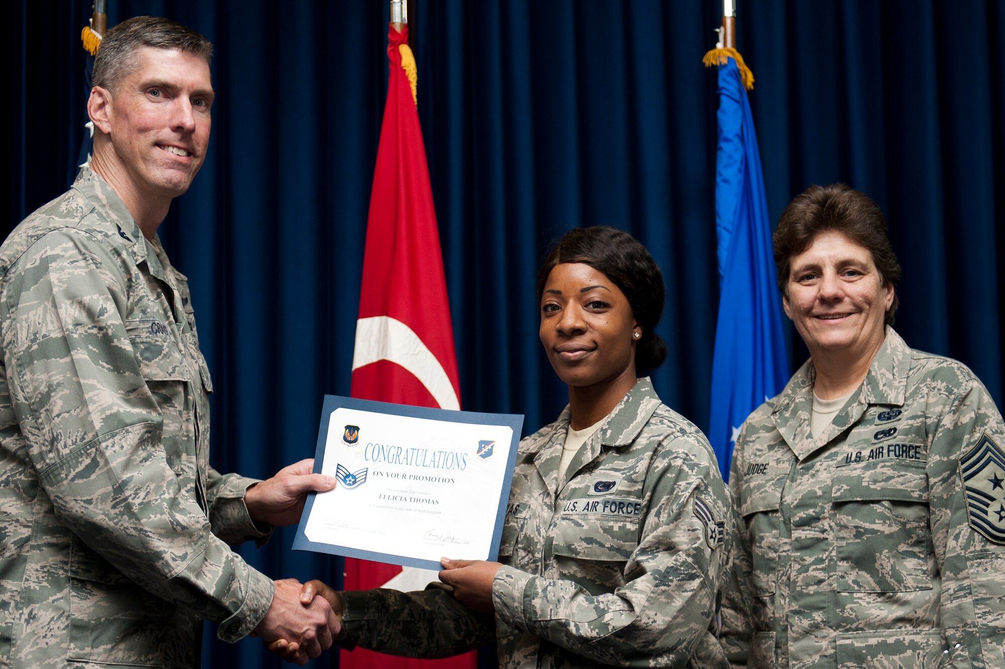 Felicia Thomas, 39th Logistics Readiness Squadron, is promoted to the rank of staff sergeant Sept. 30, 2011, at the Club Complex ballroom at Incirlik Air Base, Turkey. (U.S. Air Force photo by Tech. Sgt. Michael B. Keller/Released)
