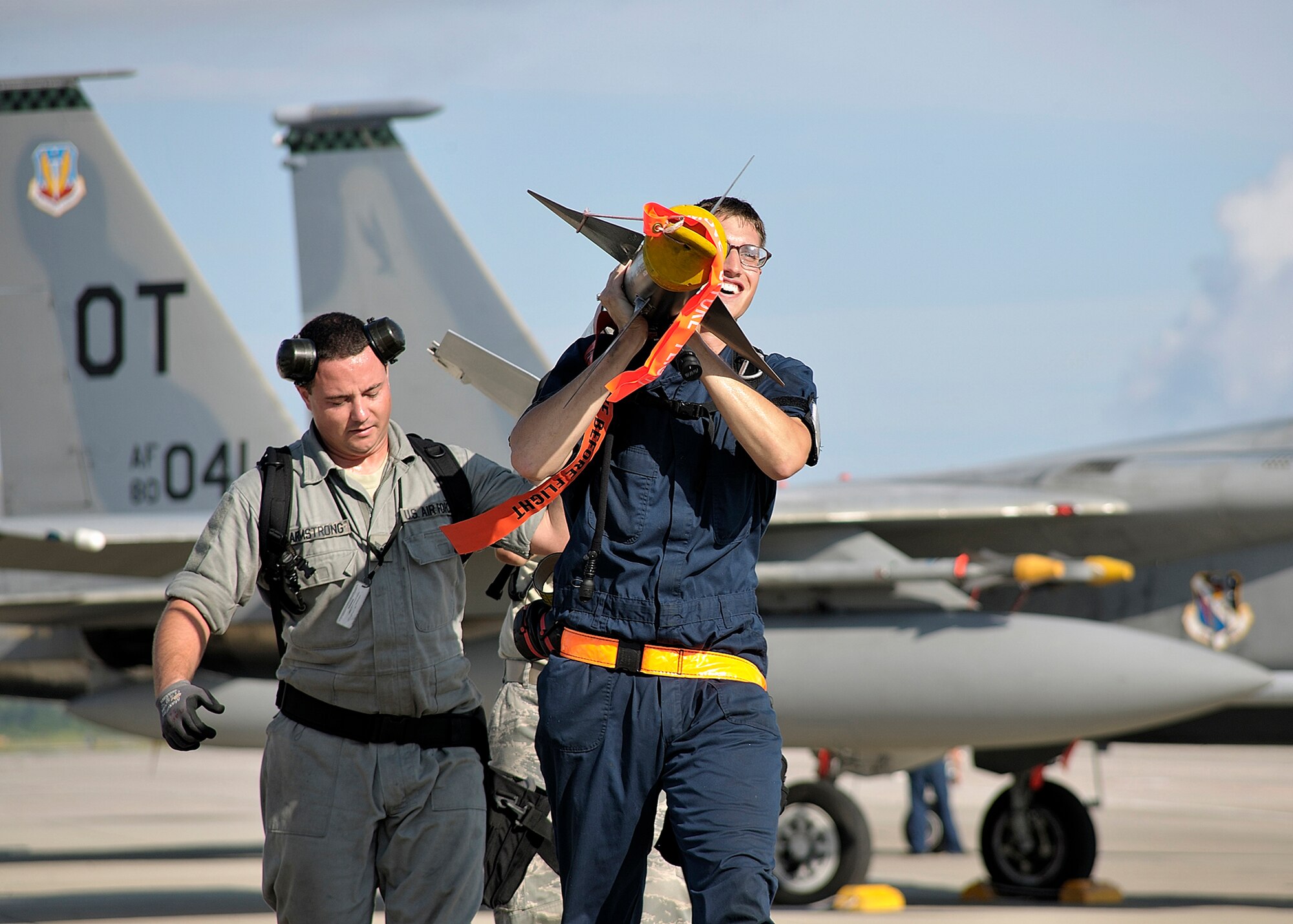 Weapons loaders carry a missile to an awaiting aircraft prior to a Combat Archer mission at Tyndall Air Force Base, Fla. Combat Archer is a weapons system evaluation program mission conducted by the 53rd Weapons Evaluation Group. The group is responsible for air-to-ground and air-to-air weapons evaluation. (U.S. Air Force photo/Tech. Sgt. John Hoffmann)    