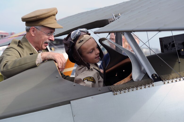 DAYTON, Ohio -- A child checks out the cockpit of an aircraft during the World War I Dawn Patrol Rendezvous from Sept. 23-25, 2011, at the National Museum of the U.S. Air Force. (U.S. Air Force photo)