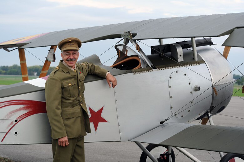 DAYTON, Ohio -- A reenactor stands with his aircraft at the World War I Dawn Patrol Rendezvous from Sept. 23-25, 2011, at the National Museum of the U.S. Air Force. (U.S. Air Force photo)