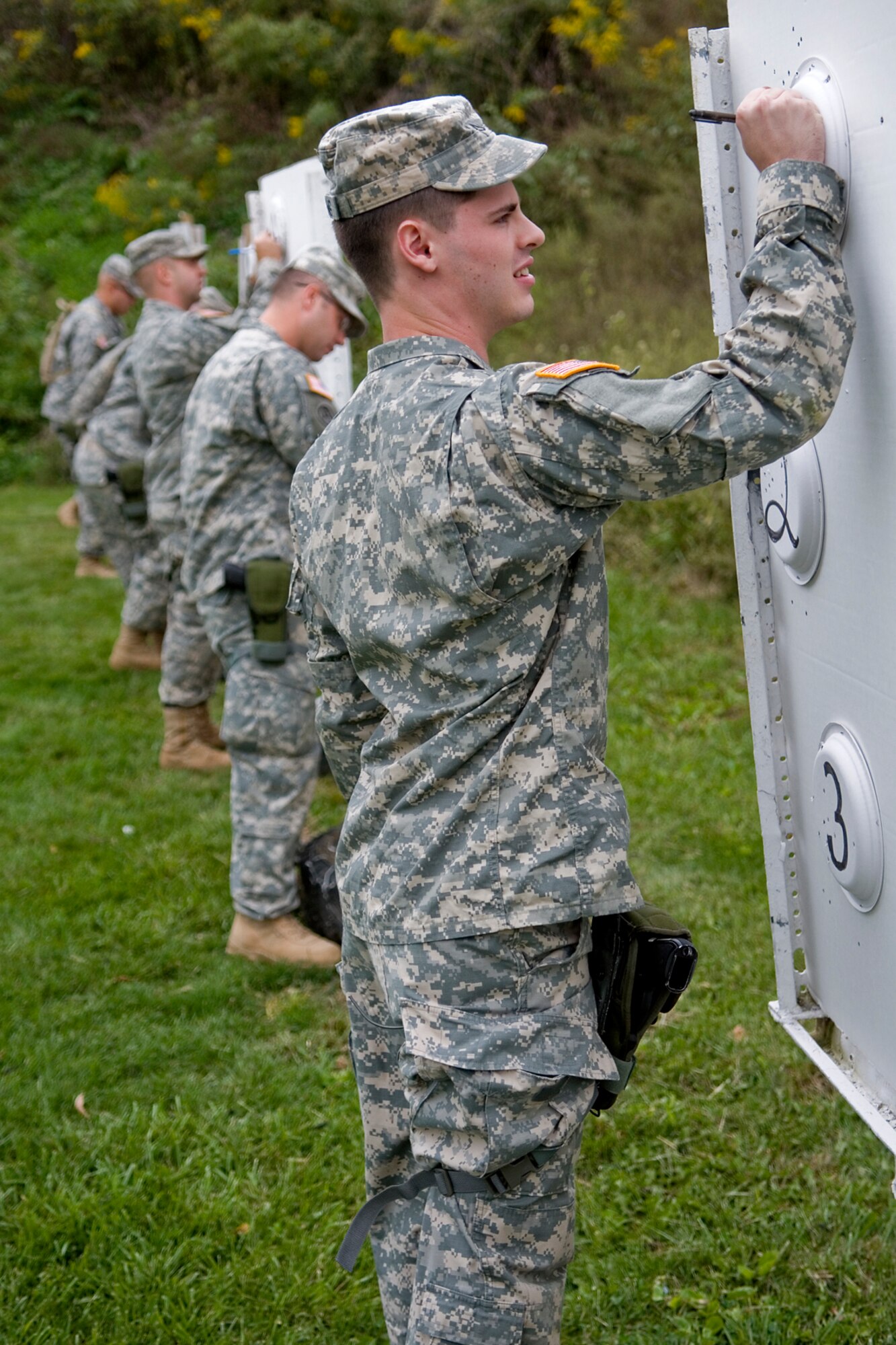 GRISSOM AIR RESERVE BASE, Ind. -- Pfc. Jonas Kiessling, 316th Tactical Psychological Operations Company, records his shots at a shooting range during the 2nd annual PSYOP Stakes Sept. 16. The marksmanship qualification was just one the events that took place during the stakes. The Soldiers took part in the two-day event to assess their strengths and weaknesses in various areas. (U.S. Air Force photo/Senior Airman Jami K. Lancette)