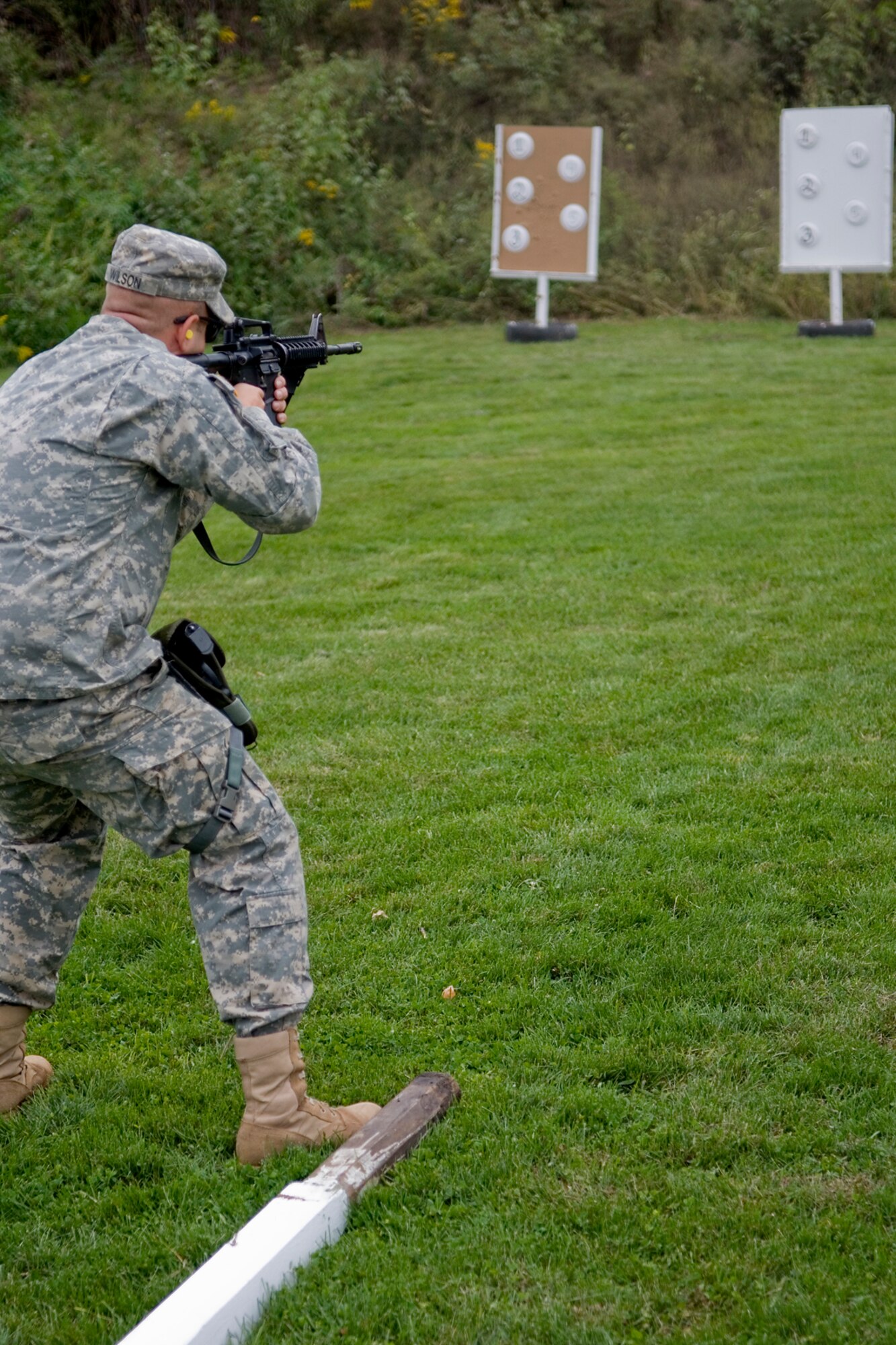 GRISSOM AIR RESERVE BASE, Ind. -- Spc. Randall Wilson, 316th Tactical Psychological Operations Company, narrows his sights on target at a shooting range. The marksmanship qualification was just one of the events that took place during the 2nd annual PSYOP stakes Sept. 16. The Soldiers took part in the two-day event to assess their strengths and weaknesses in various areas. (U.S. Air Force photo/Senior Airman Jami K. Lancette)