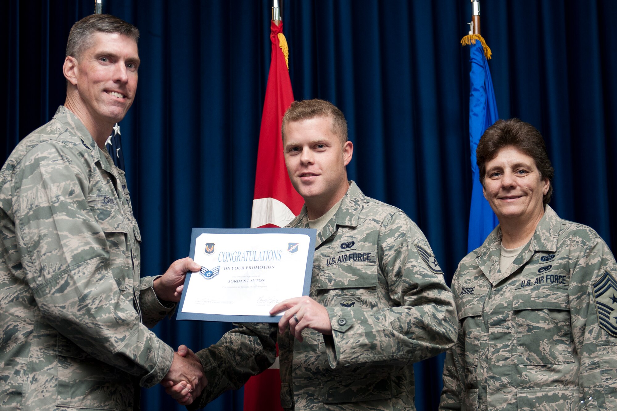 Jordan Layton, 39th Security Forces Squadron, is promoted to the rank of staff sergeant Sept. 30, 2011, at the Club Complex ballroom at Incirlik Air Base, Turkey. (U.S. Air Force photo by Tech. Sgt. Michael B. Keller/Released)