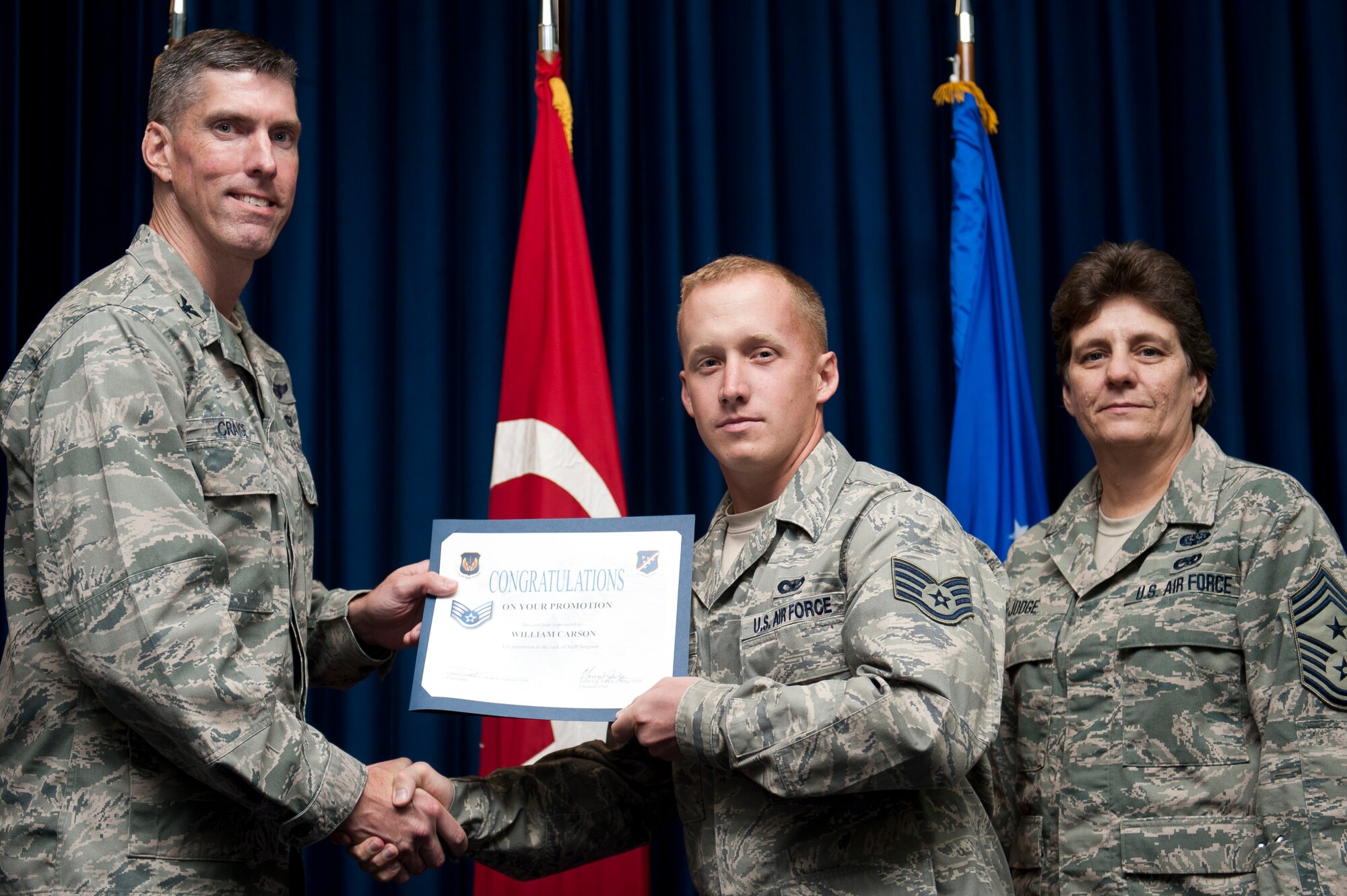 William Carson, 39th Security Forces Squadron, is promoted to the rank of staff sergeant Sept. 30, 2011, at the Club Complex ballroom at Incirlik Air Base, Turkey. (U.S. Air Force photo by Tech. Sgt. Michael B. Keller/Released)