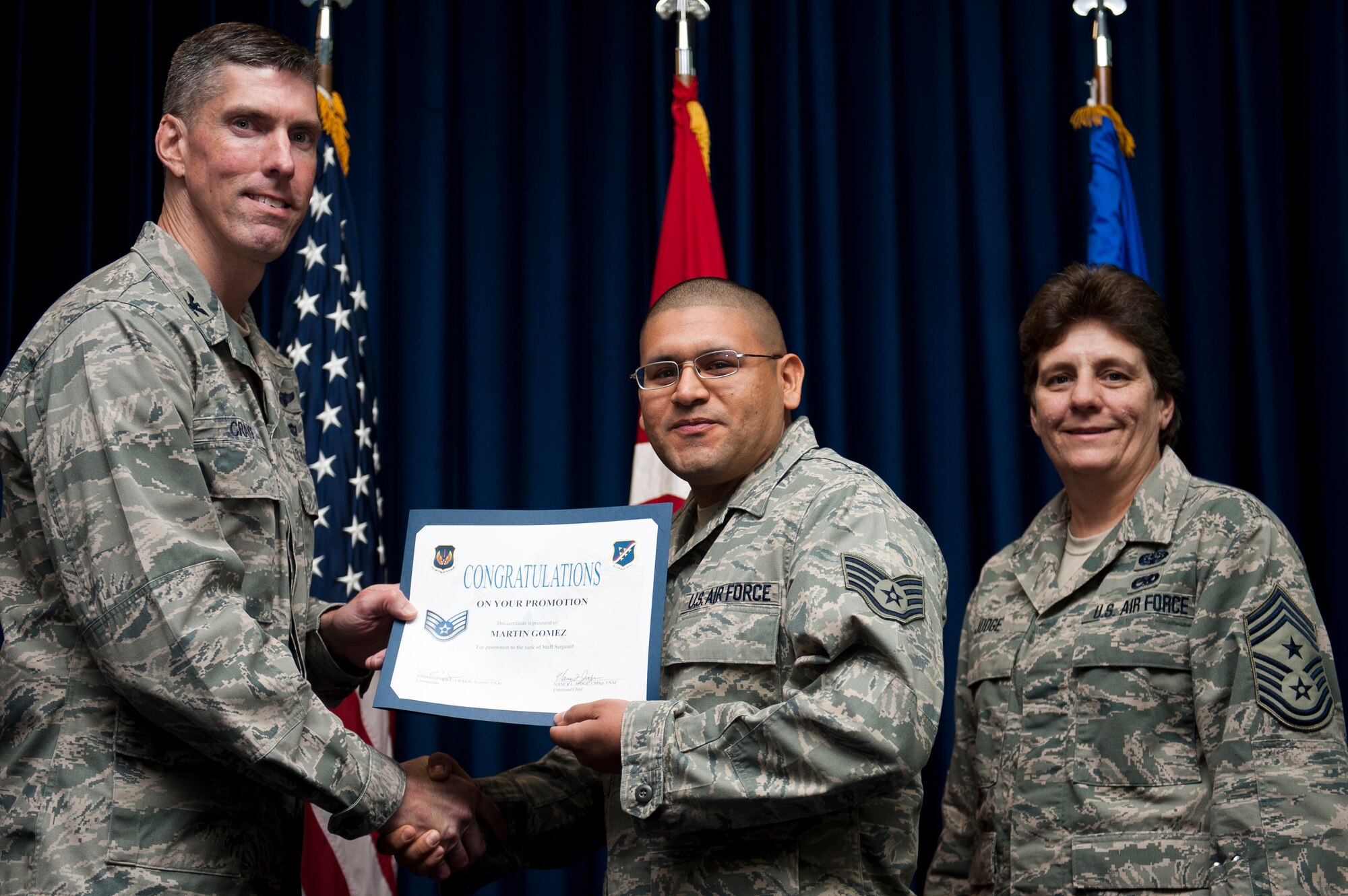 Martin Gomez, 39th Air Base Wing, is promoted to the rank of staff sergeant Sept. 30, 2011, at the Club Complex ballroom at Incirlik Air Base, Turkey. (U.S. Air Force photo by Tech. Sgt. Michael B. Keller/Released)