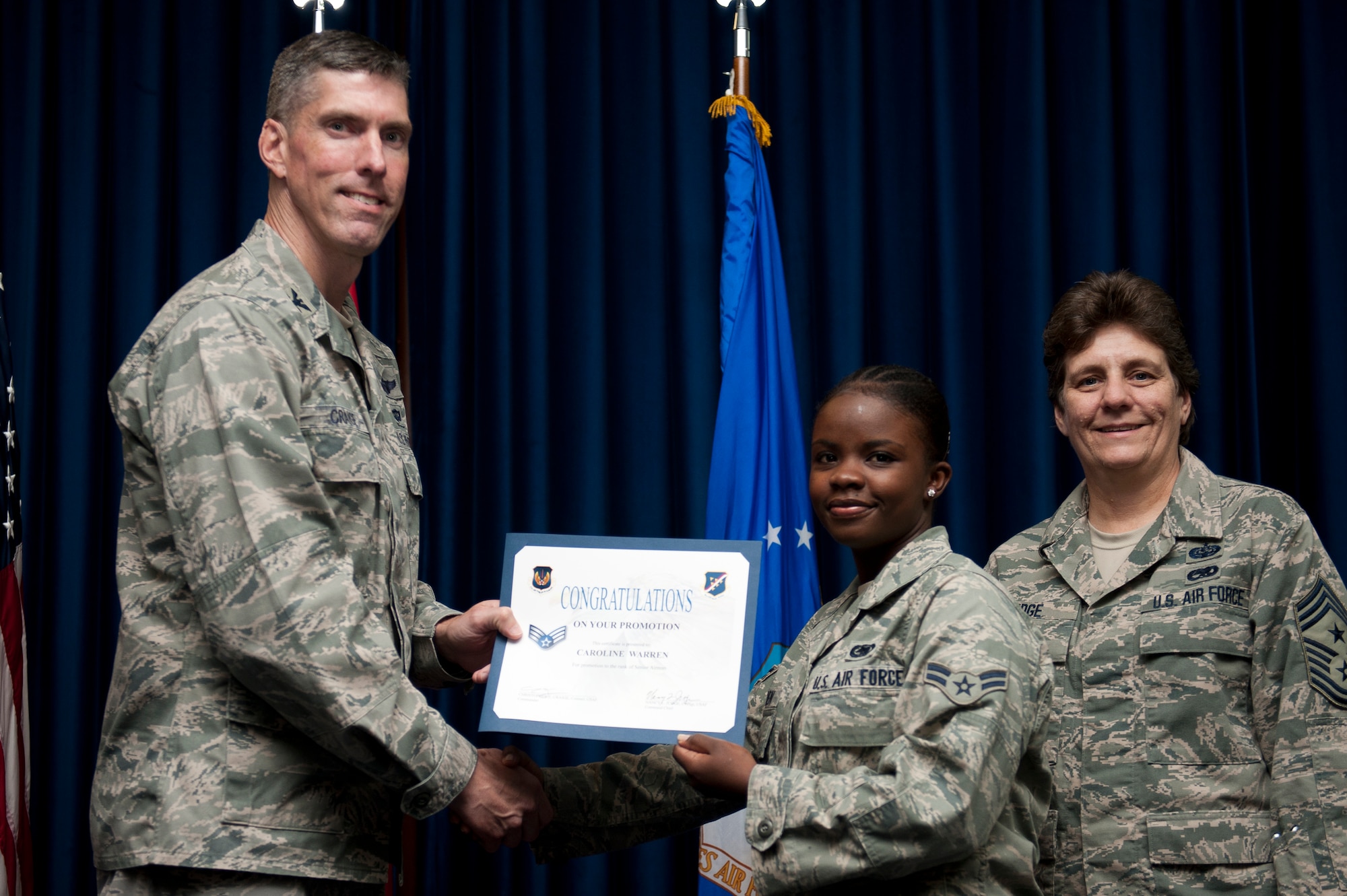 Caroline Warren, 39th Logistics Readiness Squadron, is promoted to the rank of senior airman Sept. 30, 2011, at the Club Complex ballroom at Incirlik Air Base, Turkey. (U.S. Air Force photo by Tech. Sgt. Michael B. Keller/Released)
