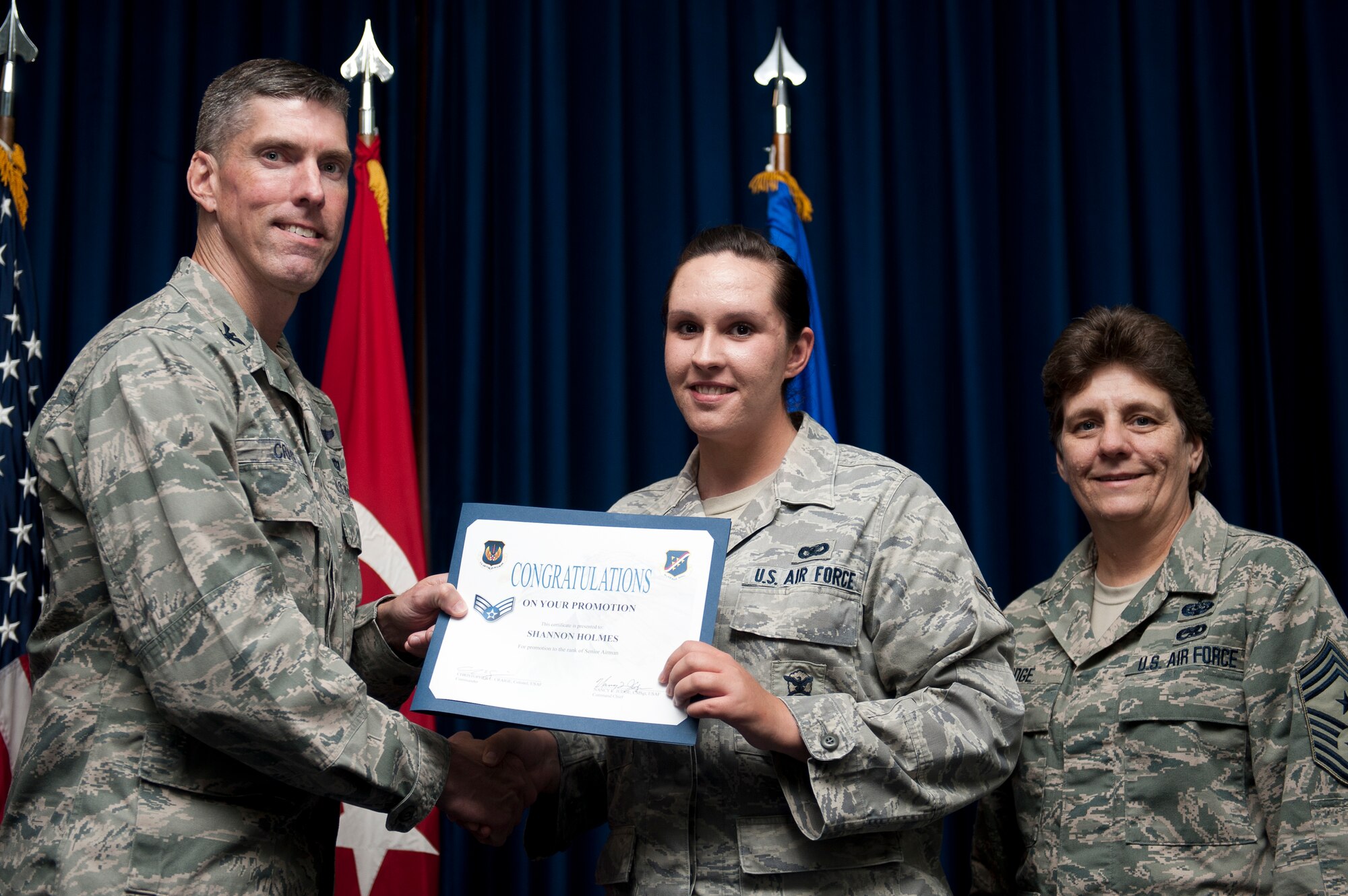 Shannon Holmes, 39th Security Forces Squadron, is promoted to the rank of senior airman Sept. 30, 2011, at the Club Complex ballroom at Incirlik Air Base, Turkey. (U.S. Air Force photo by Tech. Sgt. Michael B. Keller/Released)