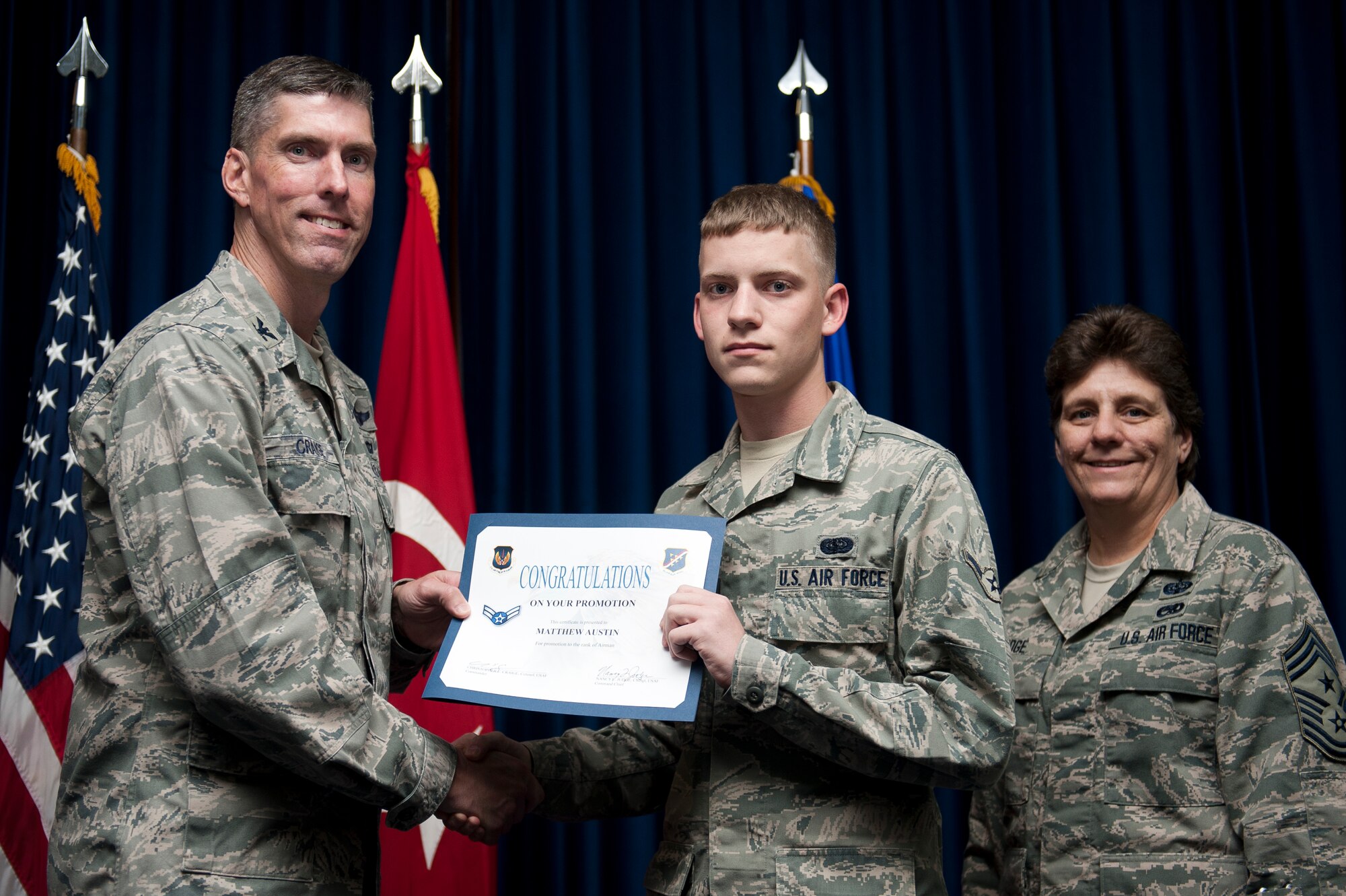 Matthew Austin, 39th Communications Squadron, is promoted to the rank of airman first class Sept. 30, 2011, at the Club Complex ballroom at Incirlik Air Base, Turkey. (U.S. Air Force photo by Tech. Sgt. Michael B. Keller/Released)