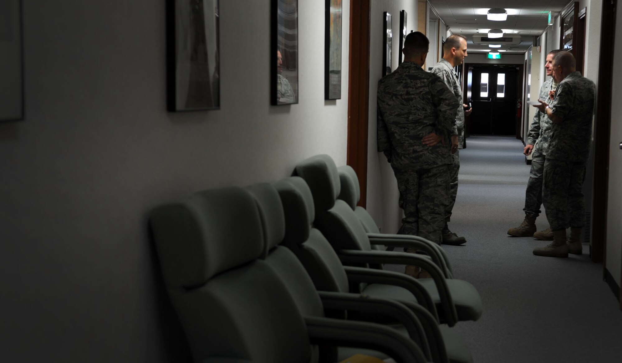 Lt. Col. Phillip Hendrix, 18th Contracting Squadron commander, Col. Brian Duffy, 18th Civil Engineer Group commander and other contracting leaders discuss end of year contracts throughout the wing at the 18th CONS building on the last day of the 2011 fiscal year, Sept. 30. End of year for the 18th CONS and Comptroller Squadron tend to be very hectic as they award last minute contracts and try to spend the wing?s budget down to the last dollar. (U.S. Air Force photo/ Senior Airman Sara Csurilla)
