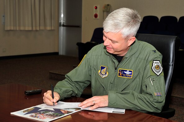 MISAWA AIR BASE, Japan – U.S. Air Force Col. Al Wimmer, 35th Fighter Wing vice commander, makes a donation to kick-off the 50th Anniversary of the Combined Federal Campaign here, Oct. 3. Each fall, millions of Federal employees are invited to donate to one or more of the 40,000 plus charities during the campaign. (U.S. Air Force photo/Staff Sgt. Nathan Lipscomb)
