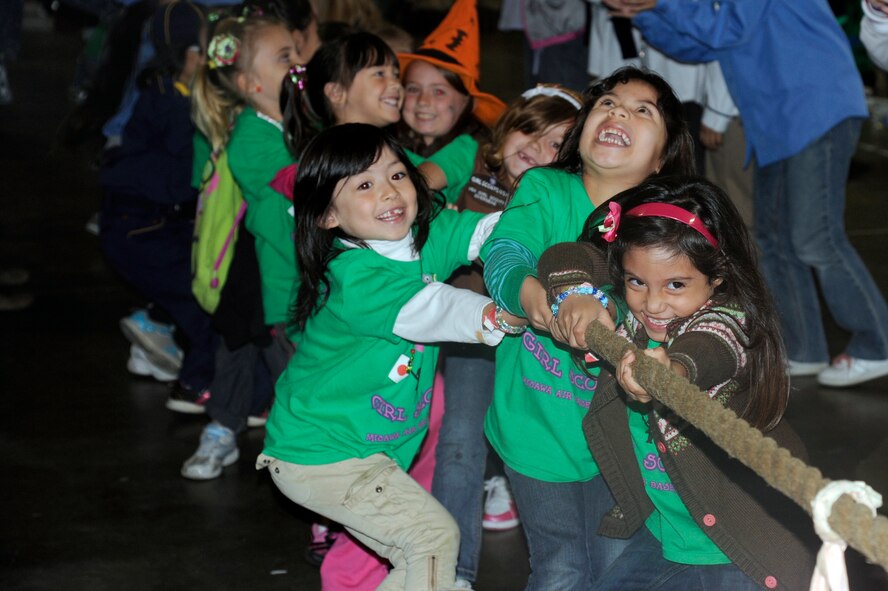 American and Japanese Girl Scouts fight for the win in a game of tug-of-war during International Scout Day at a Hangar, Misawa Air Base, Japan, Oct. 1. International Scout Day is a local celebration of bilateral friendships and cooperation. Japanese and U.S. Scouts have annually gathered at Misawa Air Base since 1959, but the first official International Scout Day occurred in 1992. More than 200 Boy and Girl Scouts from Misawa Air Base and more than 300 Japanese Boy and Girl Scouts attended this year’s event. (U.S. Air Force photo/Tech. Sgt. Marie Brown) 
