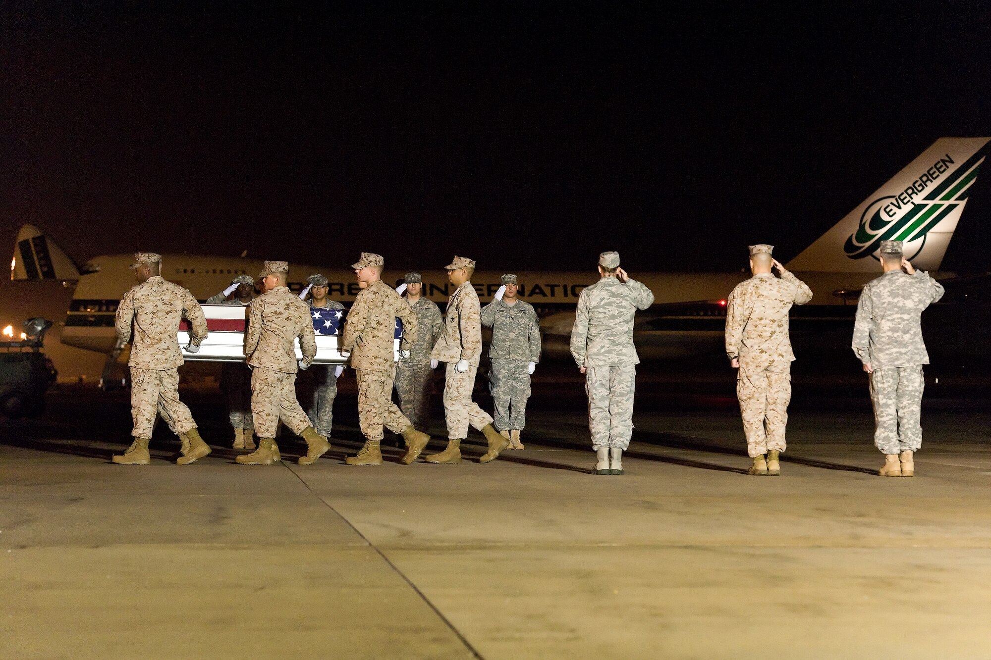 A U.S. Marine Corps carry team transfers the remains of Marine Sgt. Christopher Diaz, of Albuquerque, N.M., at Dover Air Force Base, Del., Oct. 1, 2011. Diaz was assigned to Headquarters Battalion, Marine Corps Air Ground Combat Center, Twentynine Palms, Calif. (U.S. Air Force photo/Roland Balik)