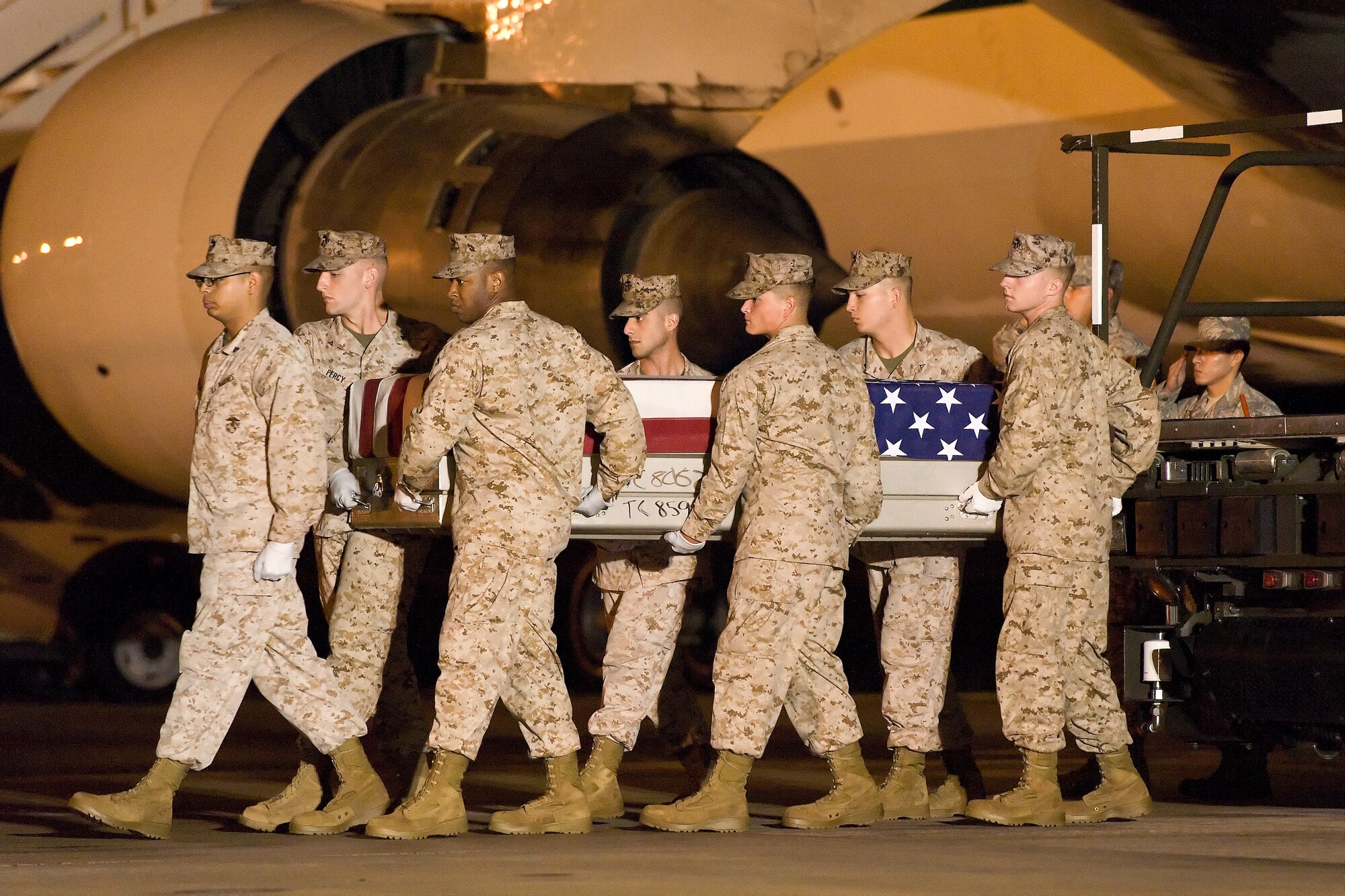 A U.S. Marine Corps carry team transfers the remains of Marine Staff Sgt. Nicholas A. Sprovtsoff, of Davison, Mich., at Dover Air Force Base, Del., Oct. 1, 2011. Sprovtsoff was assigned to 1st Marine Special Operations Battalion, U.S. Marine Corps Forces Special Operations Command, Camp Pendleton, Calif. (U.S. Air Force photo/Roland Balik)