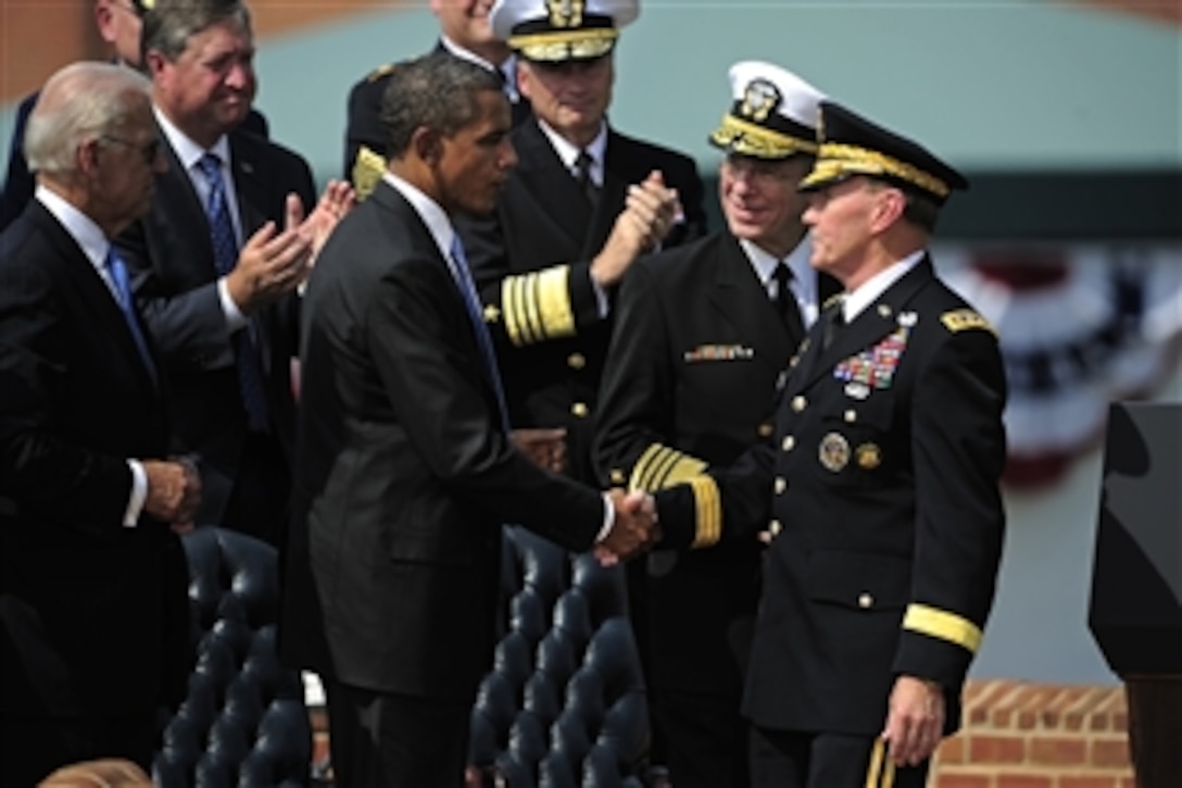 President Barack Obama congratulates the new Chairman of the Joint Chiefs of Staff Gen. Martin E. Dempsey, U.S. Army, during the chairman of the Joint Chiefs of Staff change of responsibility ceremony at Summerall Field, Joint Base Myer-Henderson Hall, Va., on Sept. 30, 2011.  Dempsey succeeded Adm. Mike Mullen, U.S. Navy, as the 18th chairman of the Joint Chiefs.  