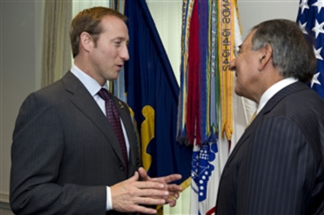 Canadian Minister of Defense Peter MacKay, left, speaks with Secretary of Defense Leon Panetta before sitting down to a meeting in the Pentagon in Arlington, Va., on Sept.30, 2011.  Panetta and Mackay are meeting to discuss security matters of mutual interest.  