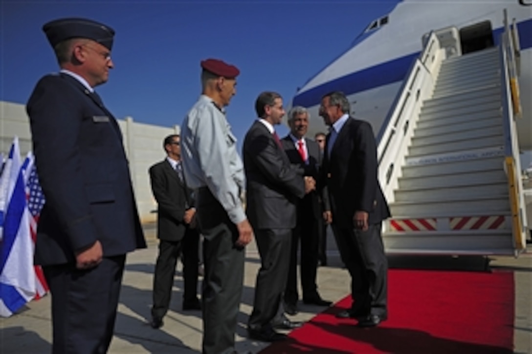 Secretary of Defense Leon E. Panetta, right, is greeted by U.S. Ambassador to Israel Dan Shapiro as he arrives at Ben Gurion International Airport, Tel Aviv, Israel, Oct. 3, 2011. Panetta is scheduled to discuss a variety of defense related issues during his trip.  